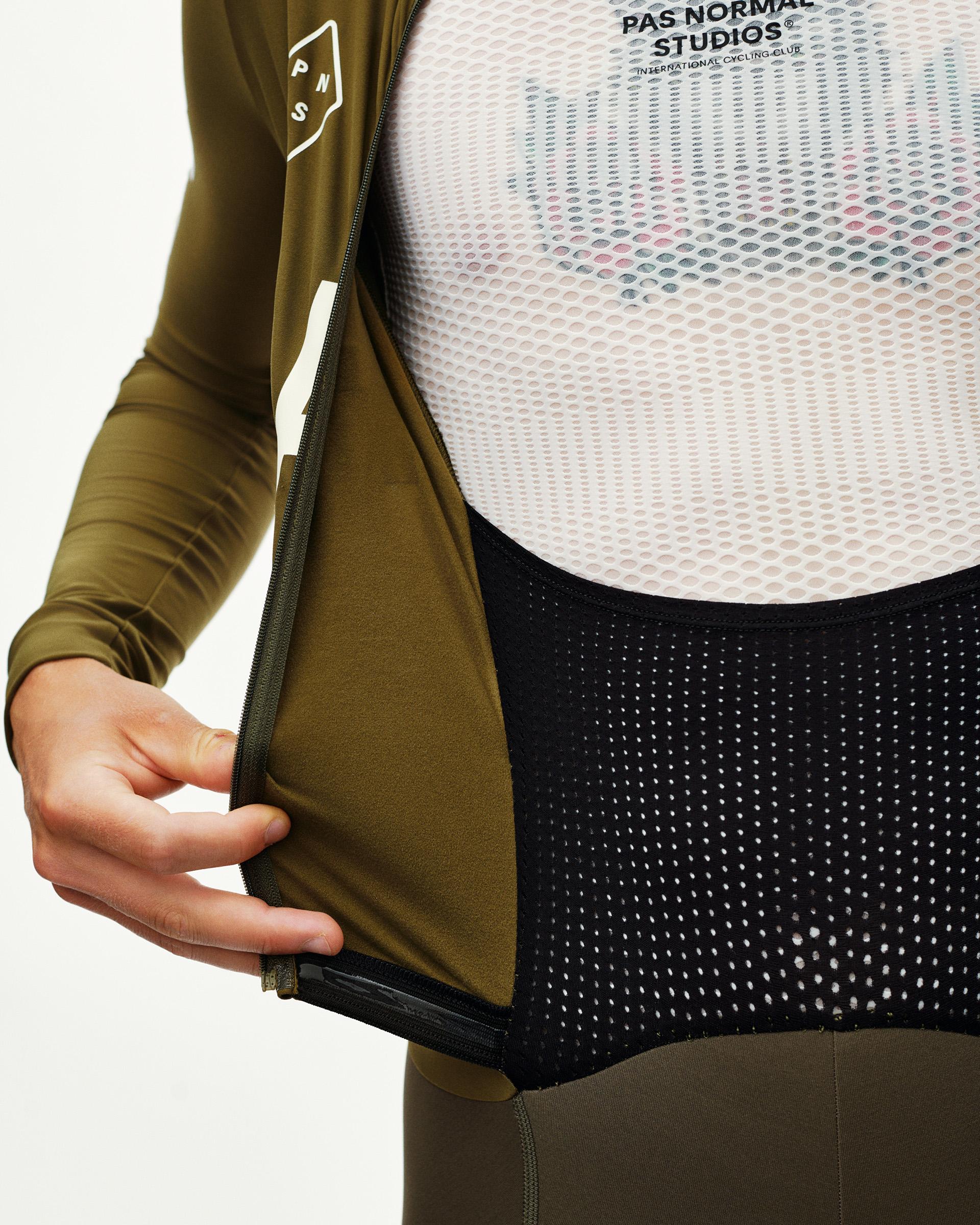 Moss Brown PAS Thermal Speedsuit, detail view on model with opened front zip and mesh inner panel
