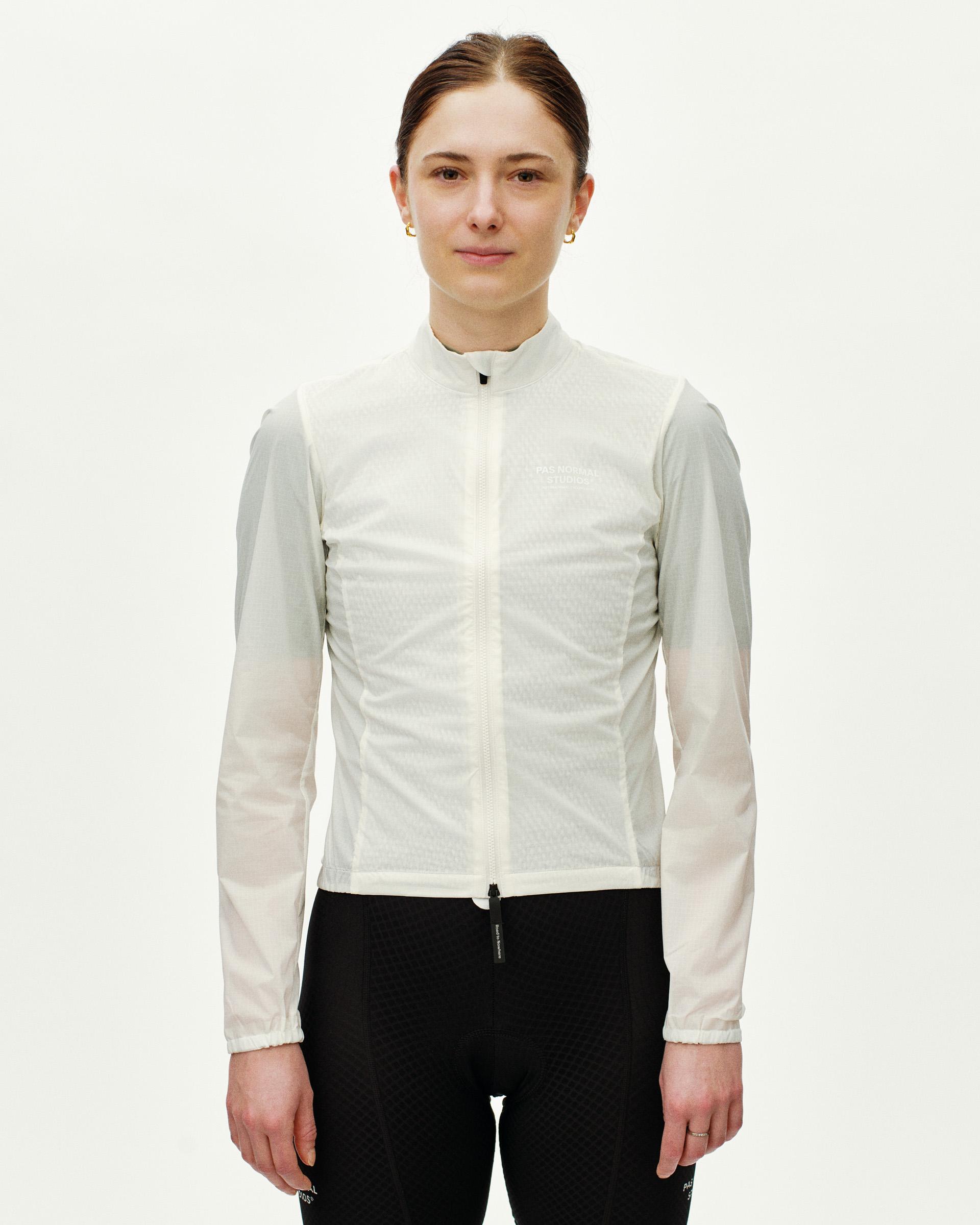 Off White Essential Insulated cycling jacket on model, front view with full-length zip and sheer sleeves