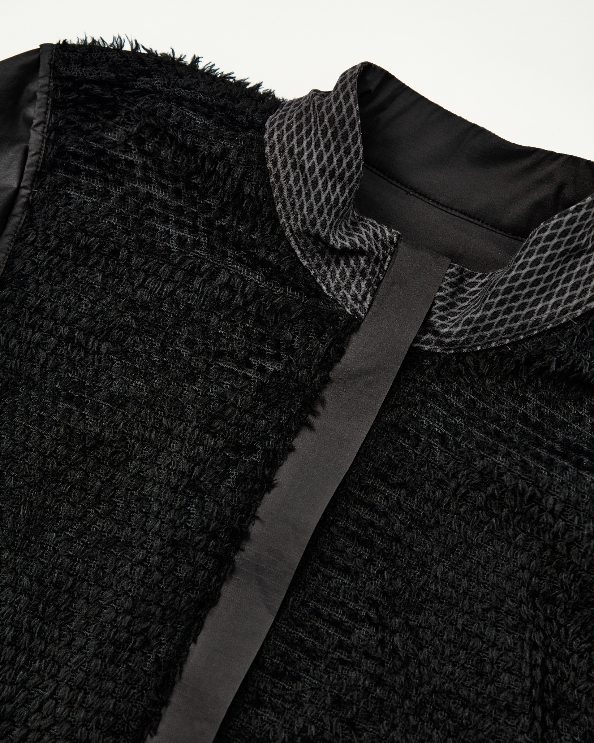 Grey Sage Essential insulated jacket, detail view showing textured outer fabric and patterned inner lining