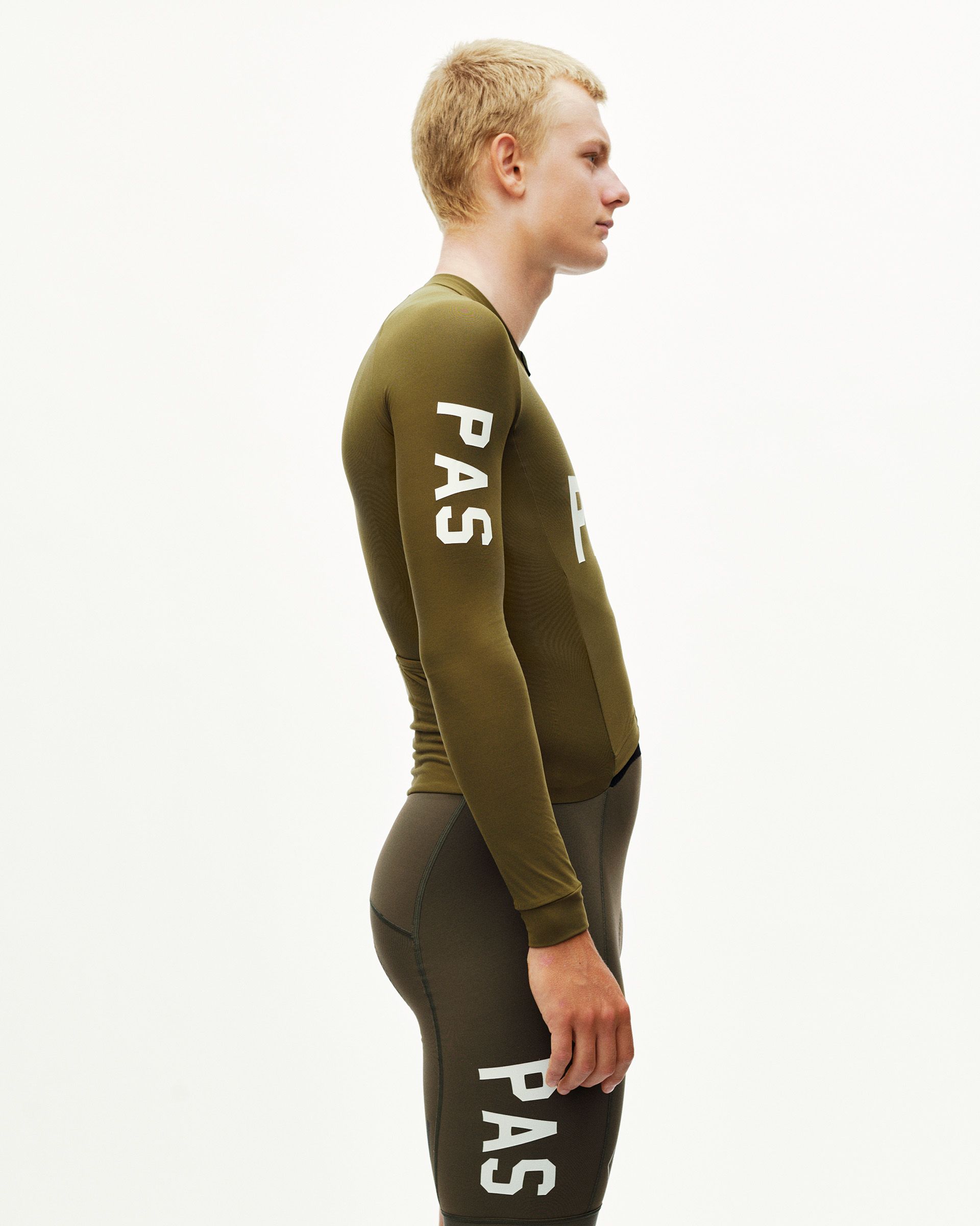 Moss Brown PAS thermal speedsuit on model, side view with white sleeve print