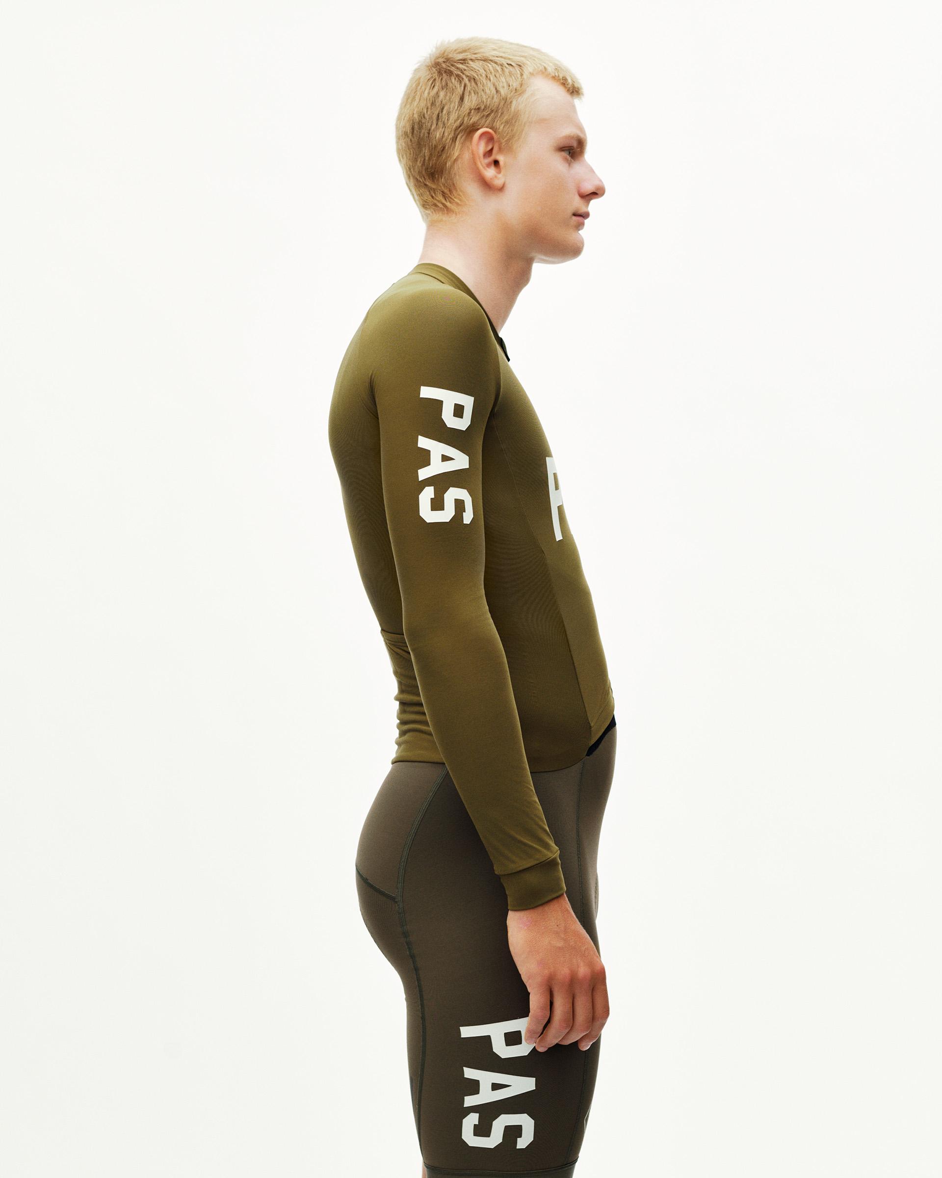 Moss Brown PAS thermal speedsuit on model, side view with white sleeve print