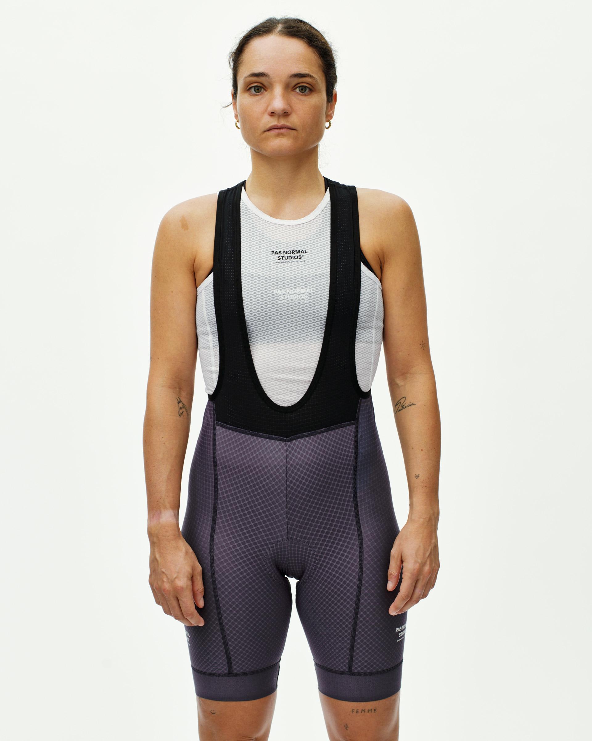 Iron Grey Essential bibs on model, front view with black straps and diamond texture pattern