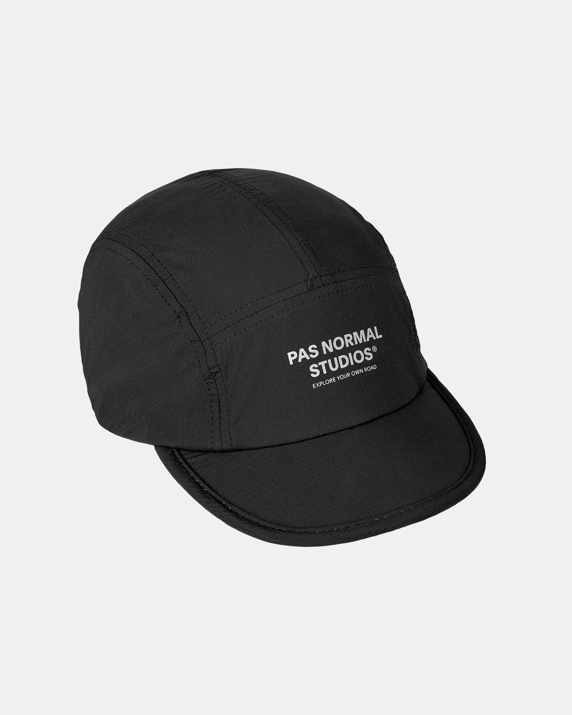 Black Balance cap, three-quarter view with white logo print on front panel