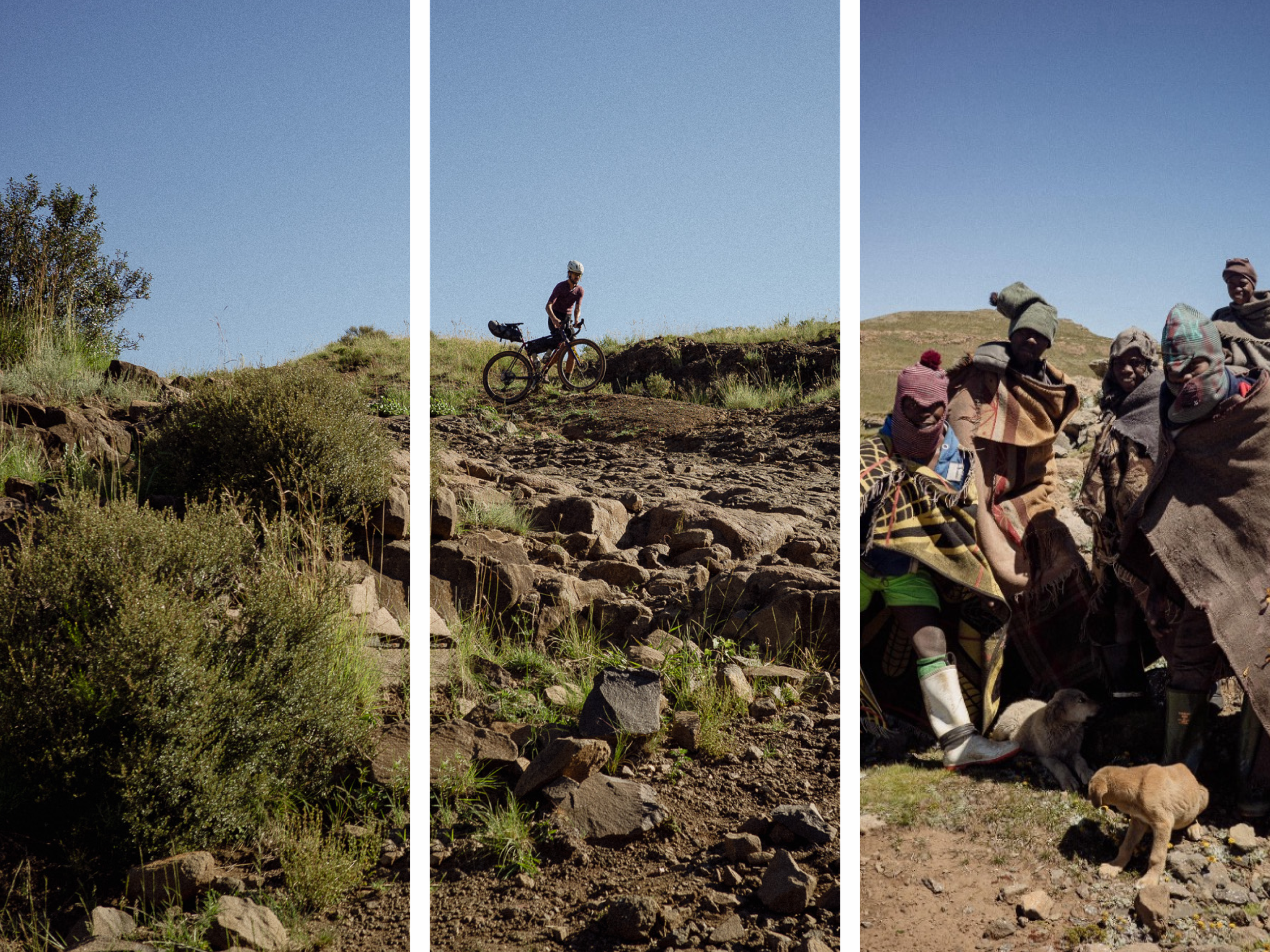 Cyclist with bike on rocky hillside terrain in Lesotho mountain landscape with local community members