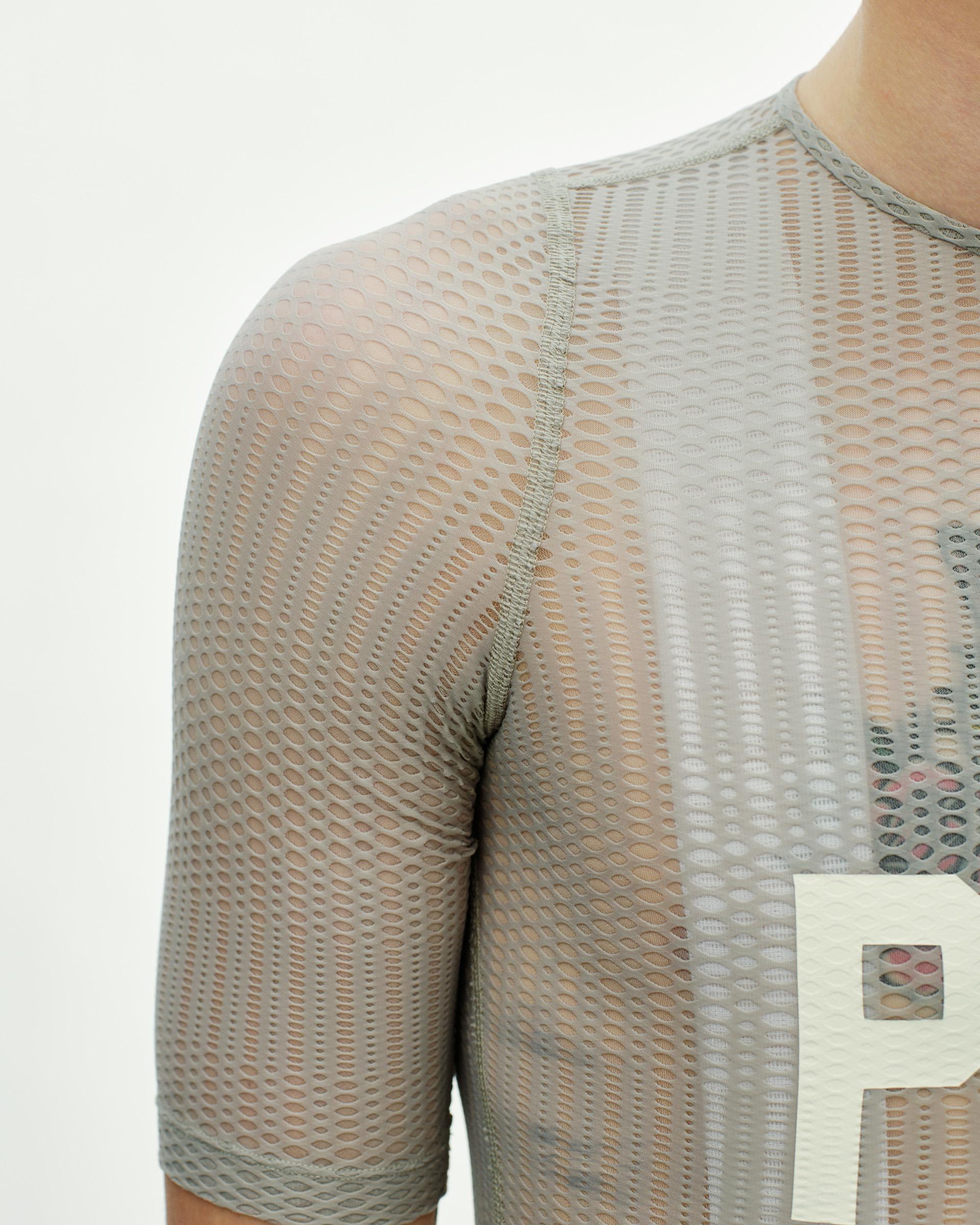 Light Grey PAS Mechanism Pro Zipless cycling jersey on model with mesh construction and white chest logo