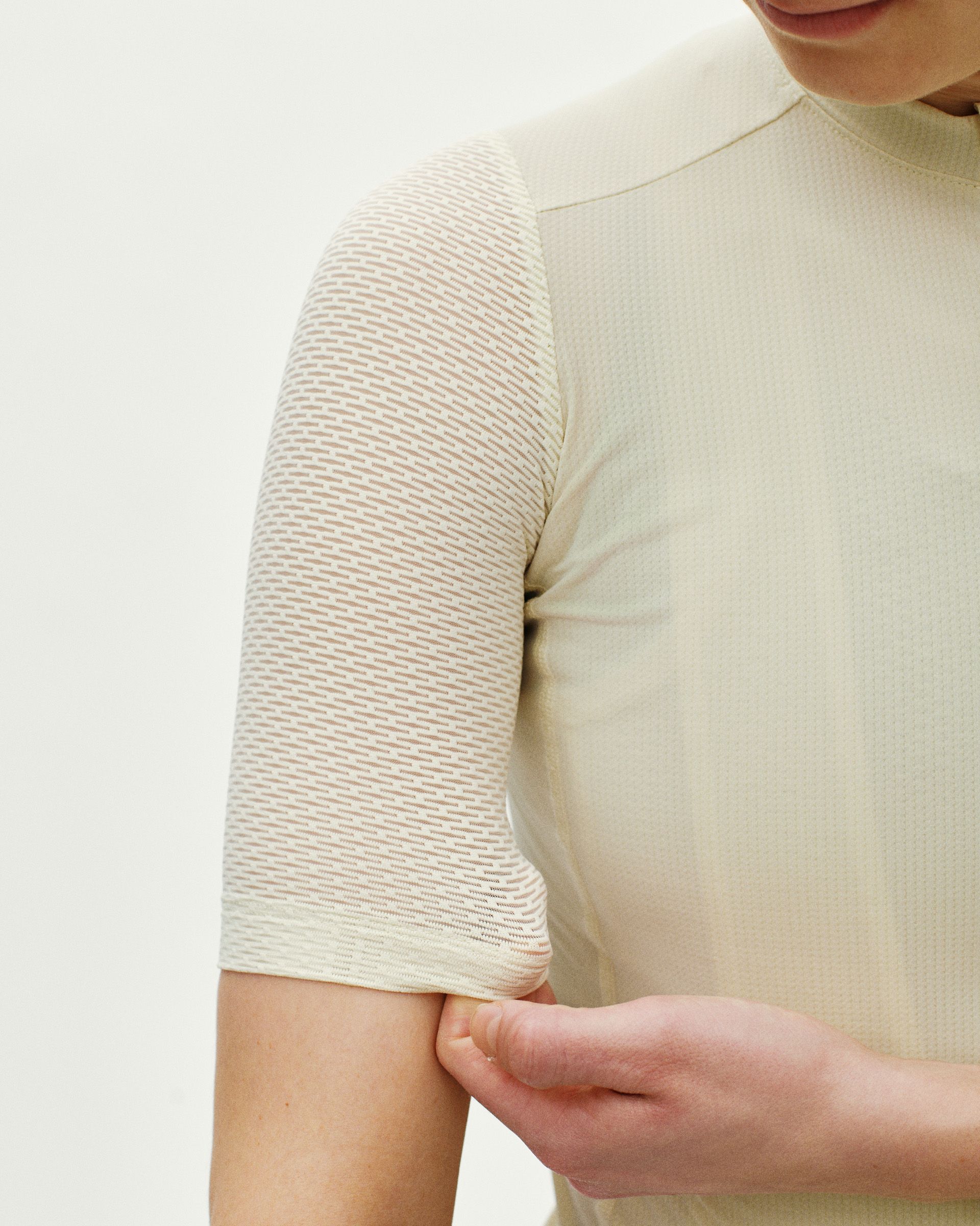 Off White Essential Light cycling jersey on model showing textured sleeve detail