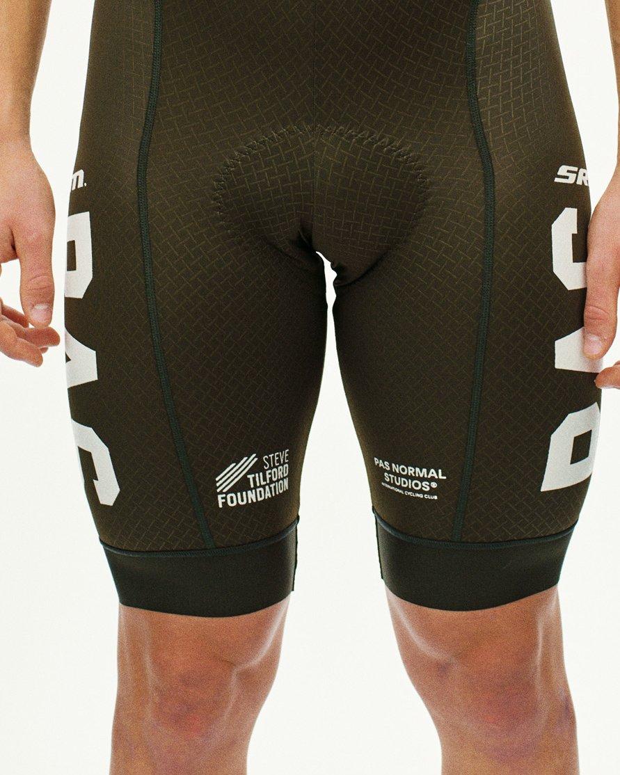 Beige STFR Mechanism Long Sleeve speedsuit on model, rear view with textured panels and white leg graphics
