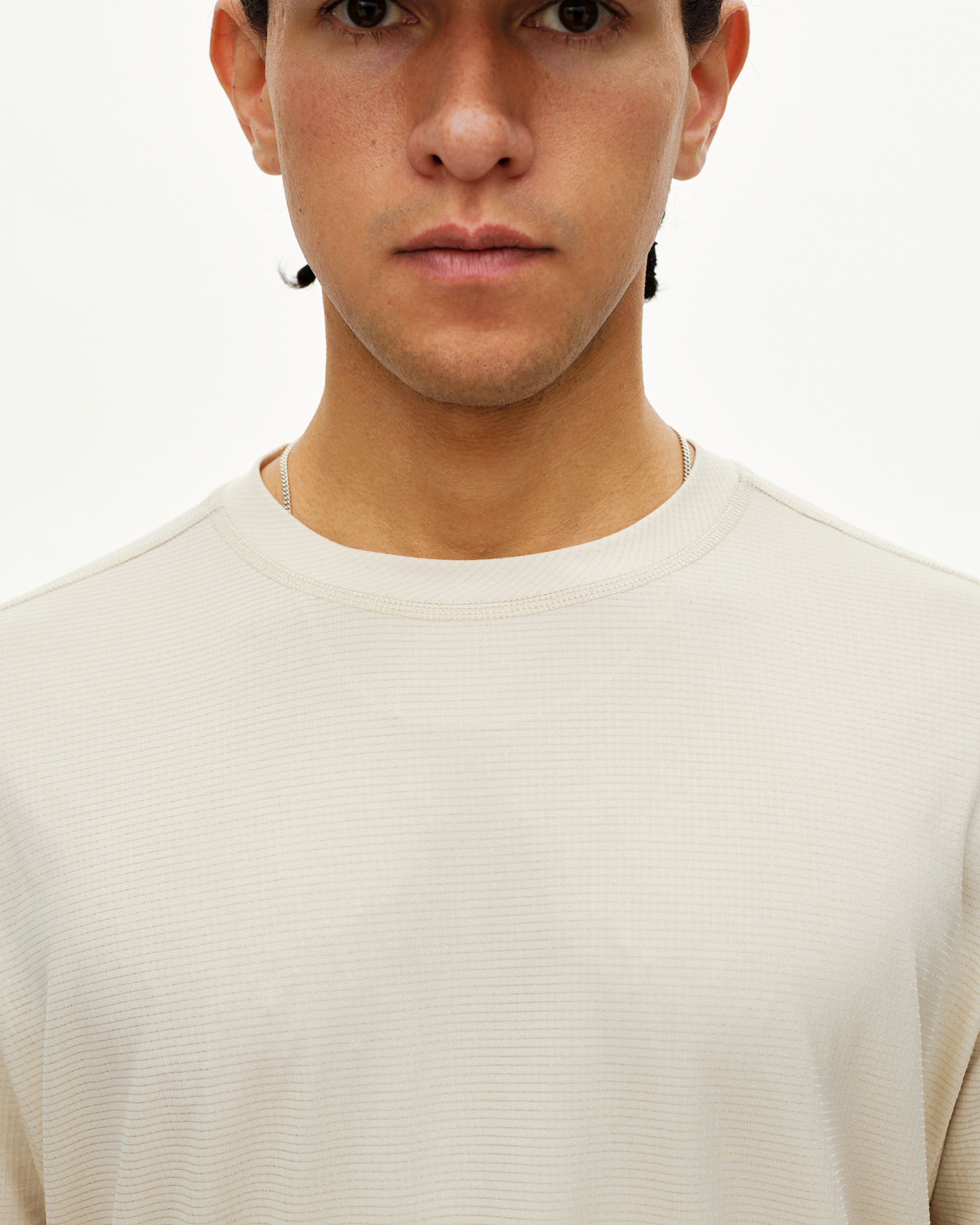 Sand Balance long sleeve T-shirt, front detail on model with ribbed texture and crew neck
