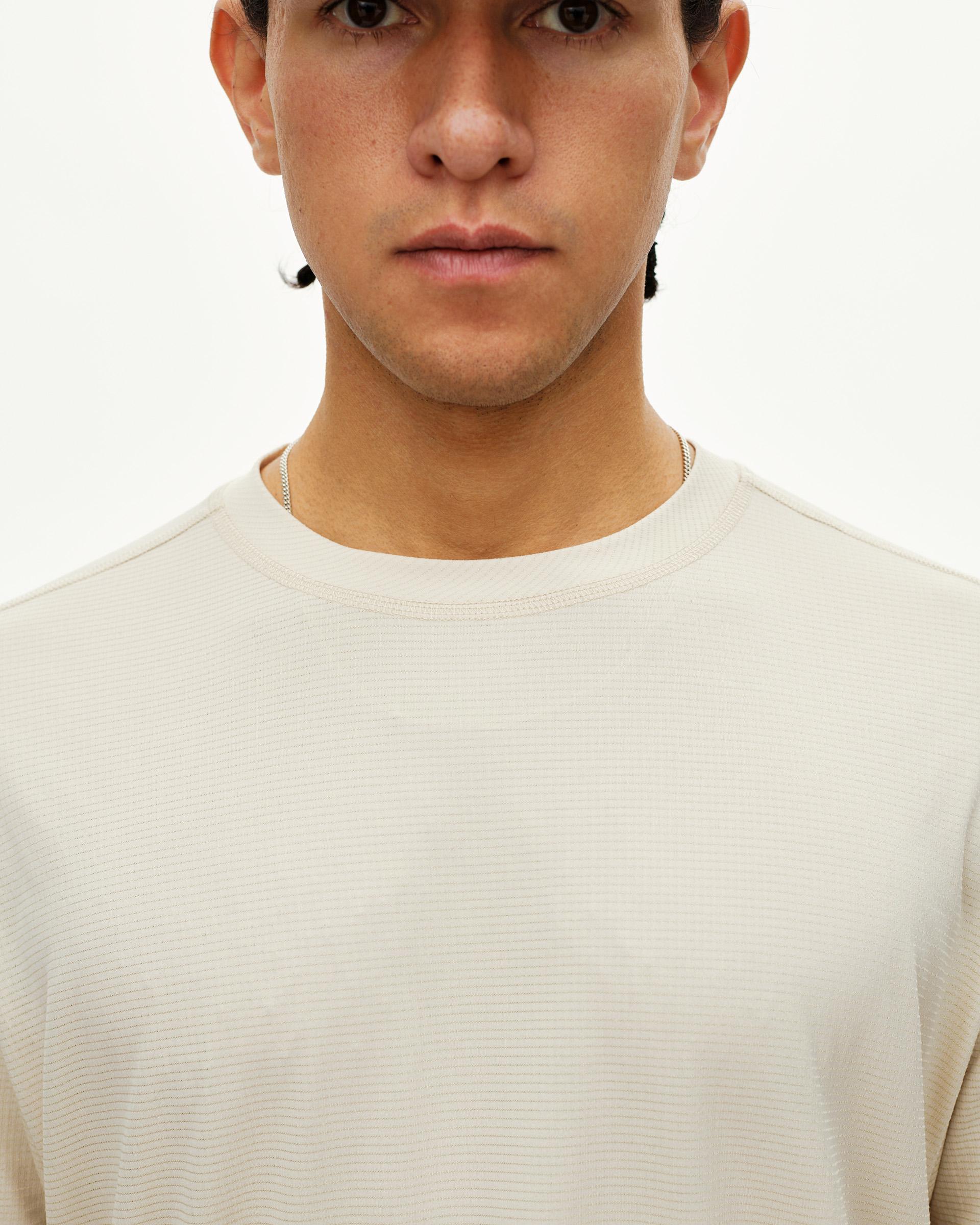 Sand Balance long sleeve T-shirt, front detail on model with ribbed texture and crew neck