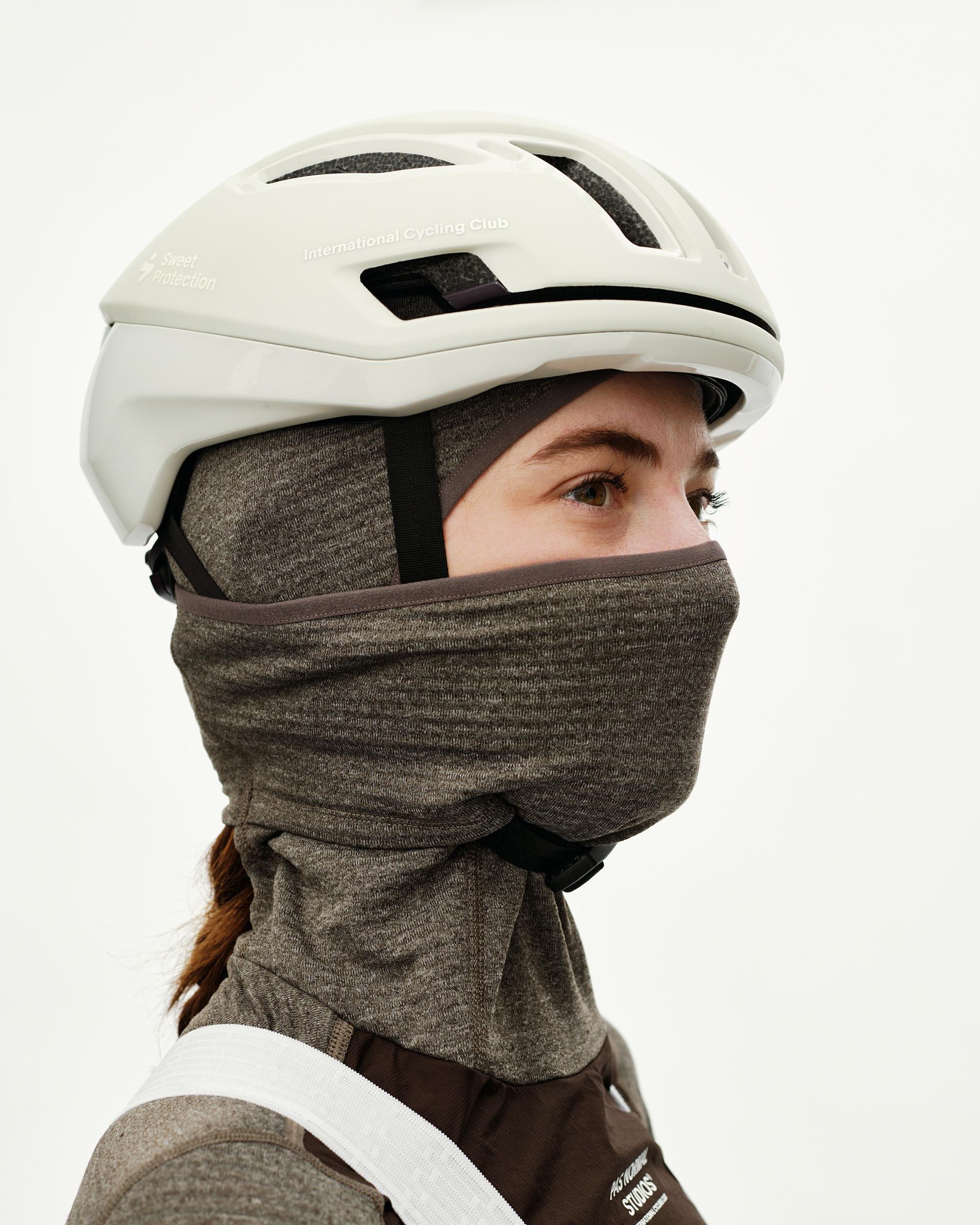 Dark Coffee brown Essential thermal hooded cycling base layer on model, side view worn as neck gaiter covering face
