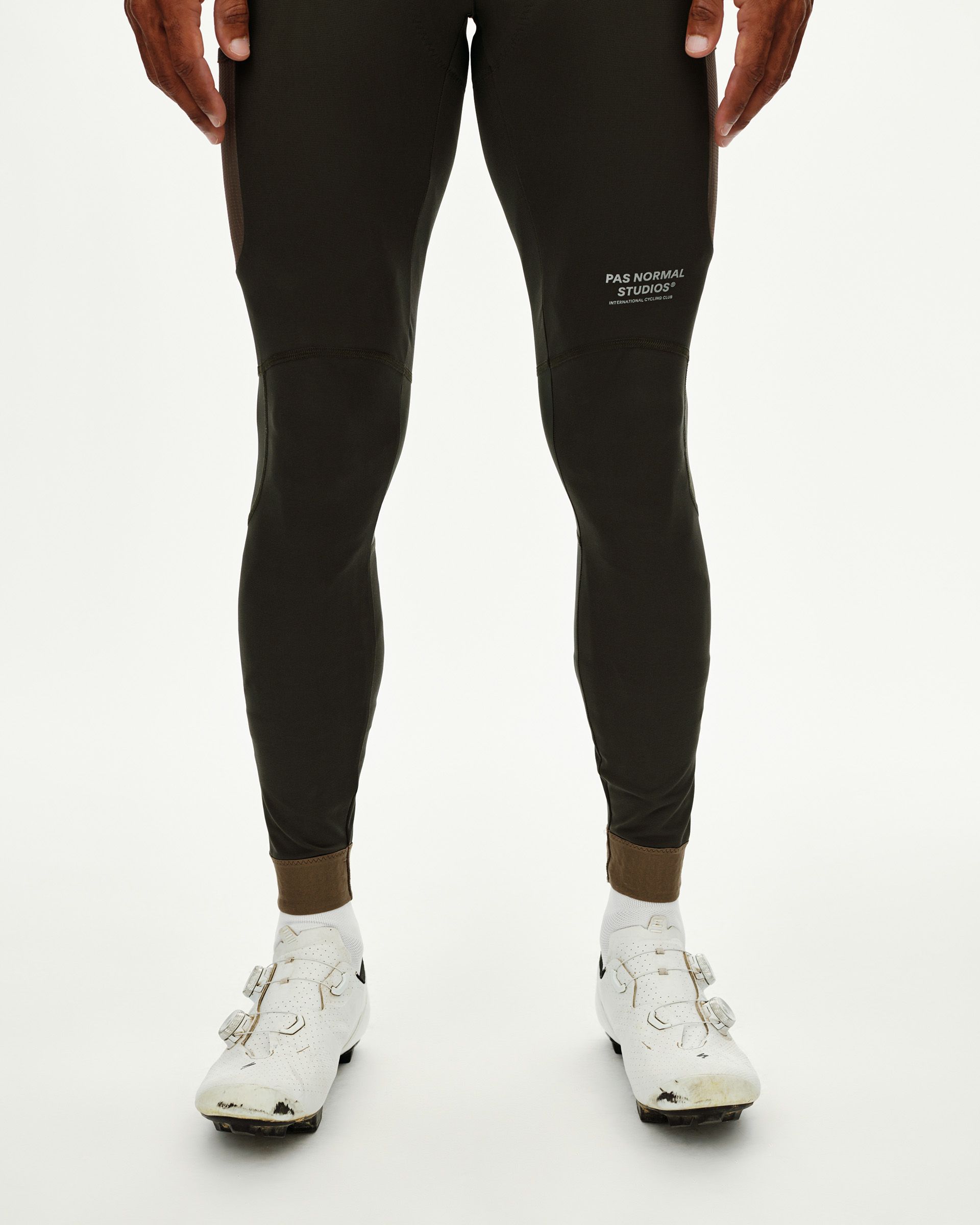 Dark Olive Escapism Long Cargo cycling bibs on model, front view with contrast ankle cuff