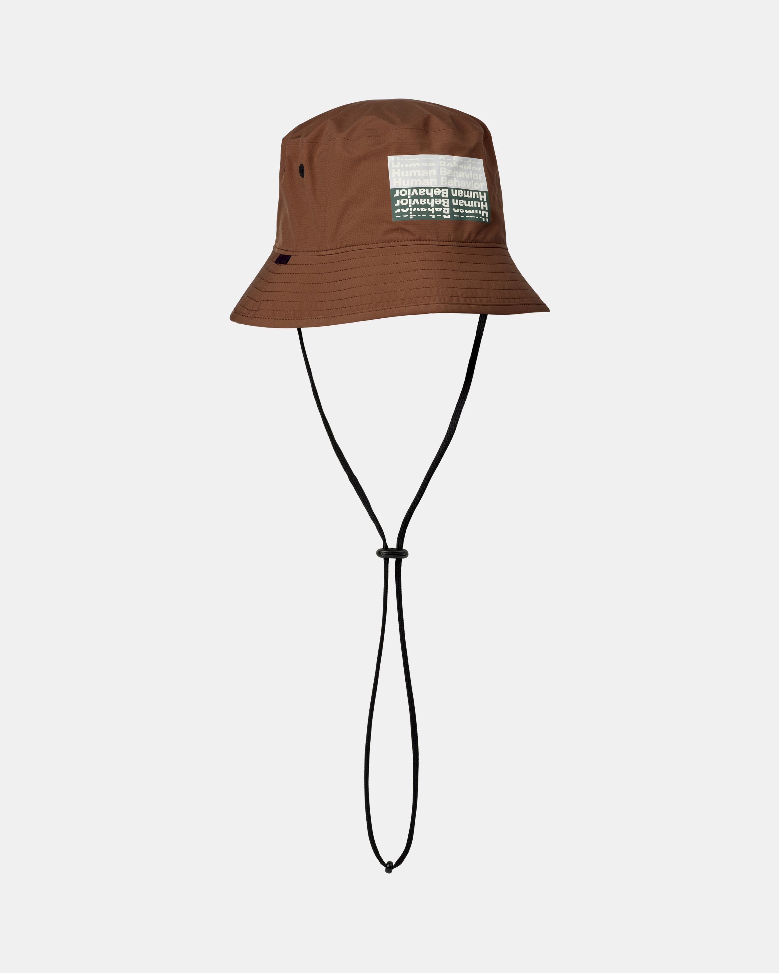 Hazel brown T.K.O. Off-Race Shield bucket hat, three-quarter view with graphic front patch and chin cord