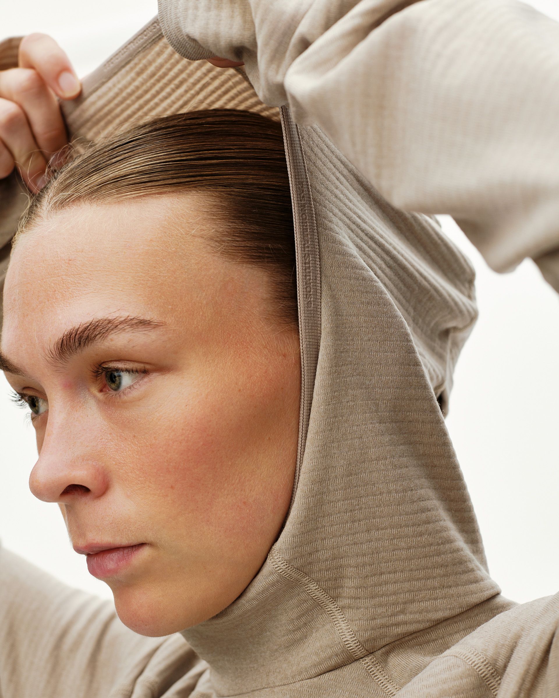 Haze purple Balance Thermal hoodie on model, close-up detail of ribbed hood being pulled up