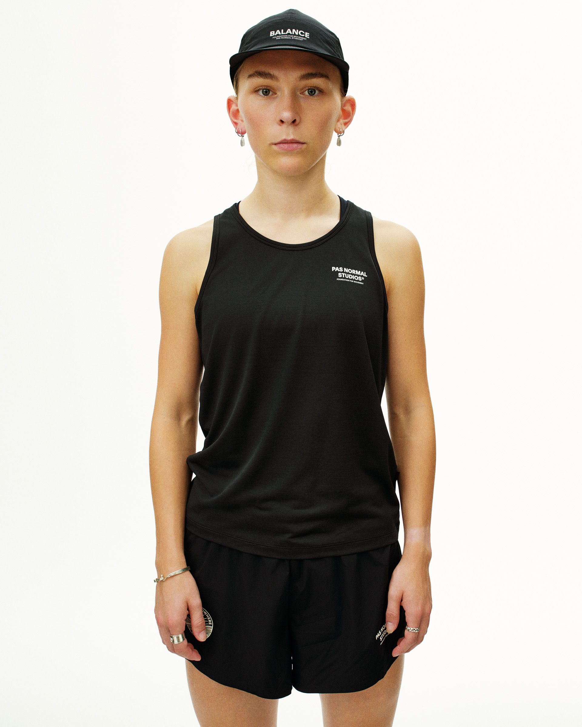 Black Balance singlet on model with white chest print