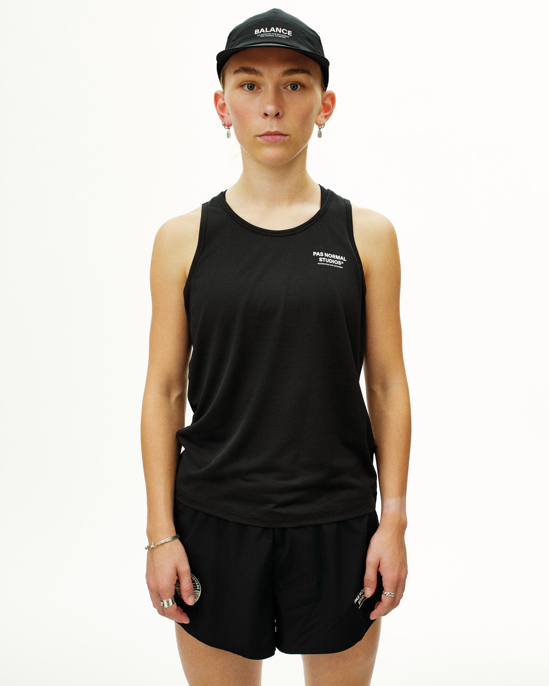 Black Balance singlet on model with white chest print