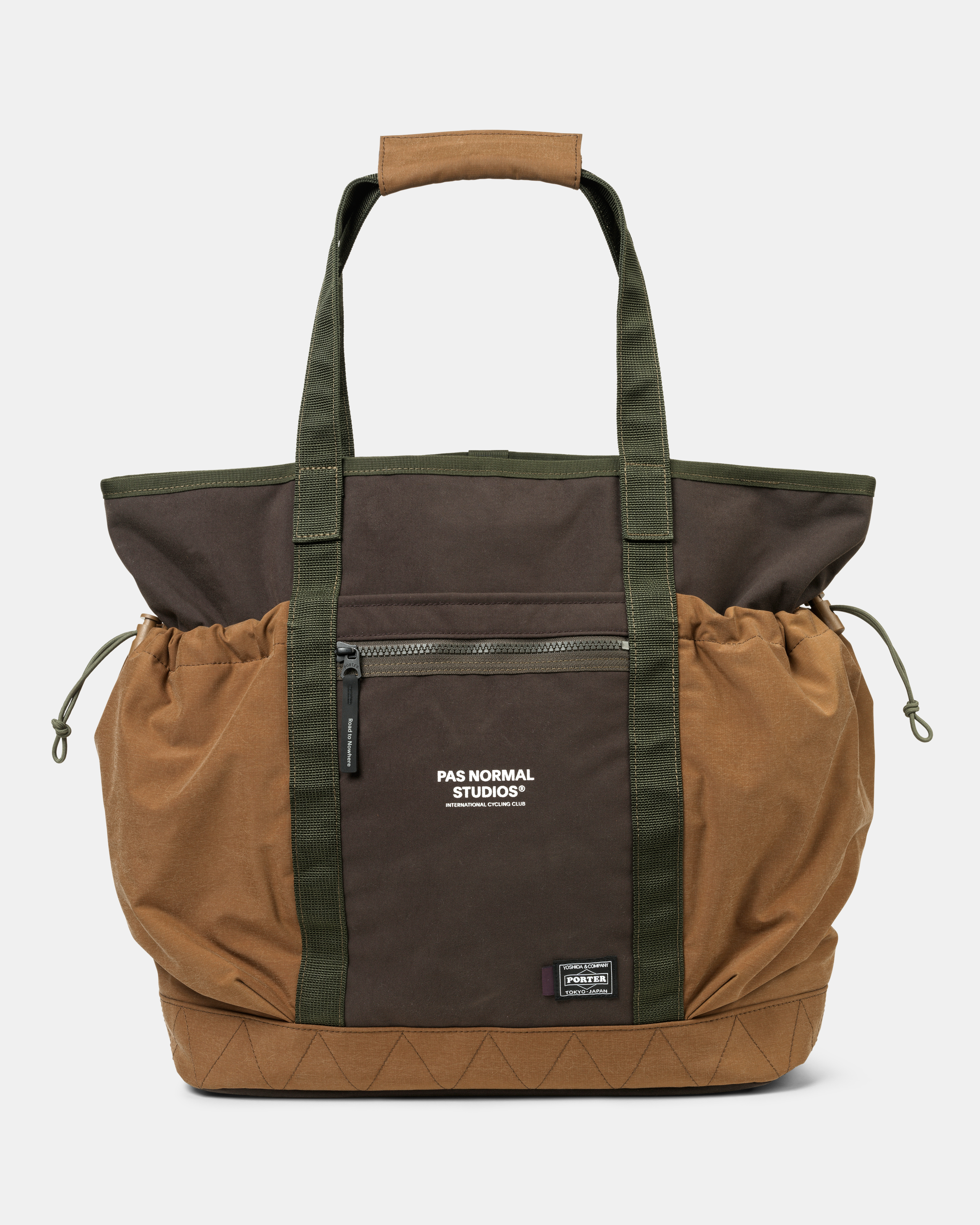 Light Brown Porter-Yoshida tote bag, front view with dark panel, olive webbing straps, and drawstring sides