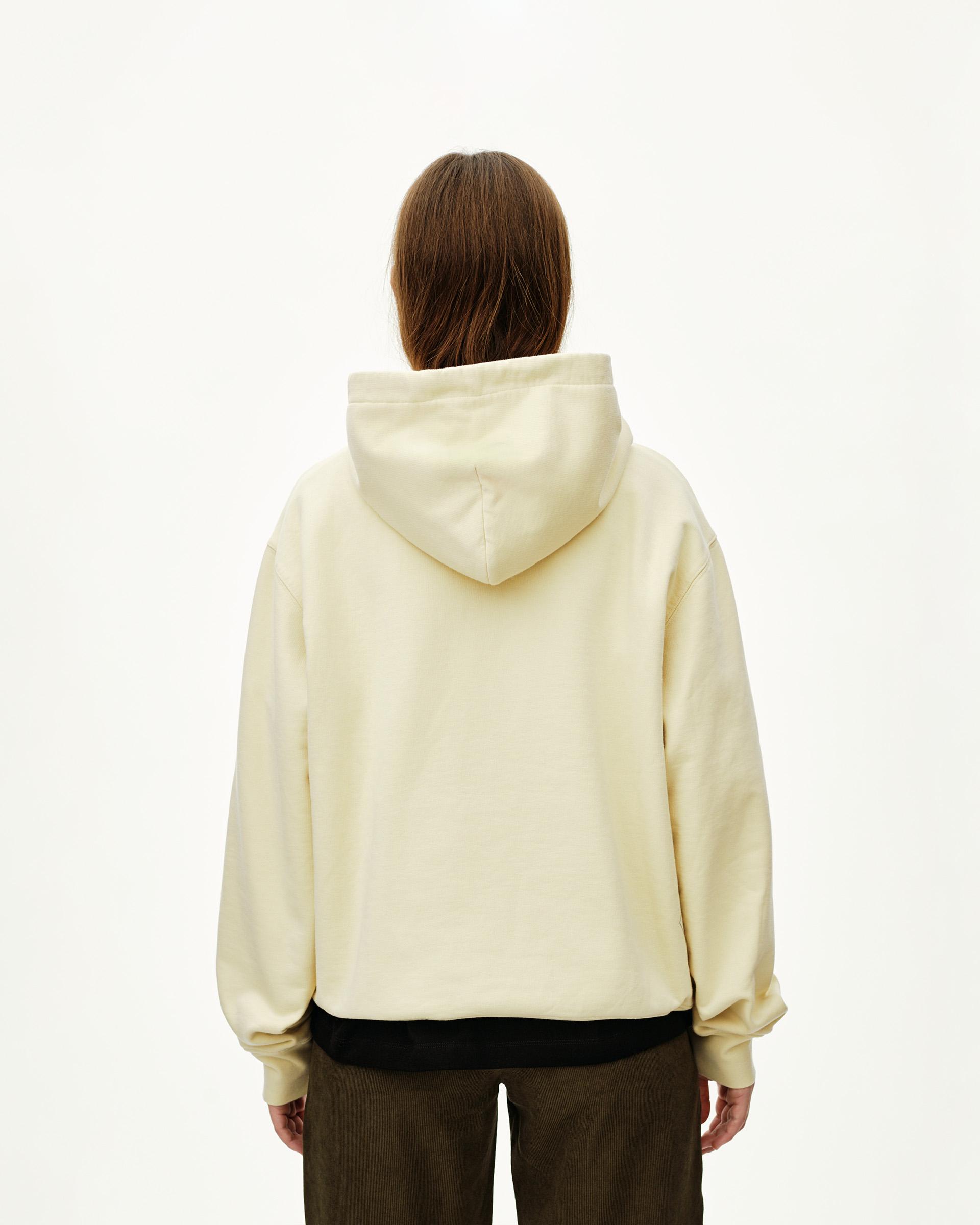 Sand Off-Race hoodie, rear view on model with black contrast hem band