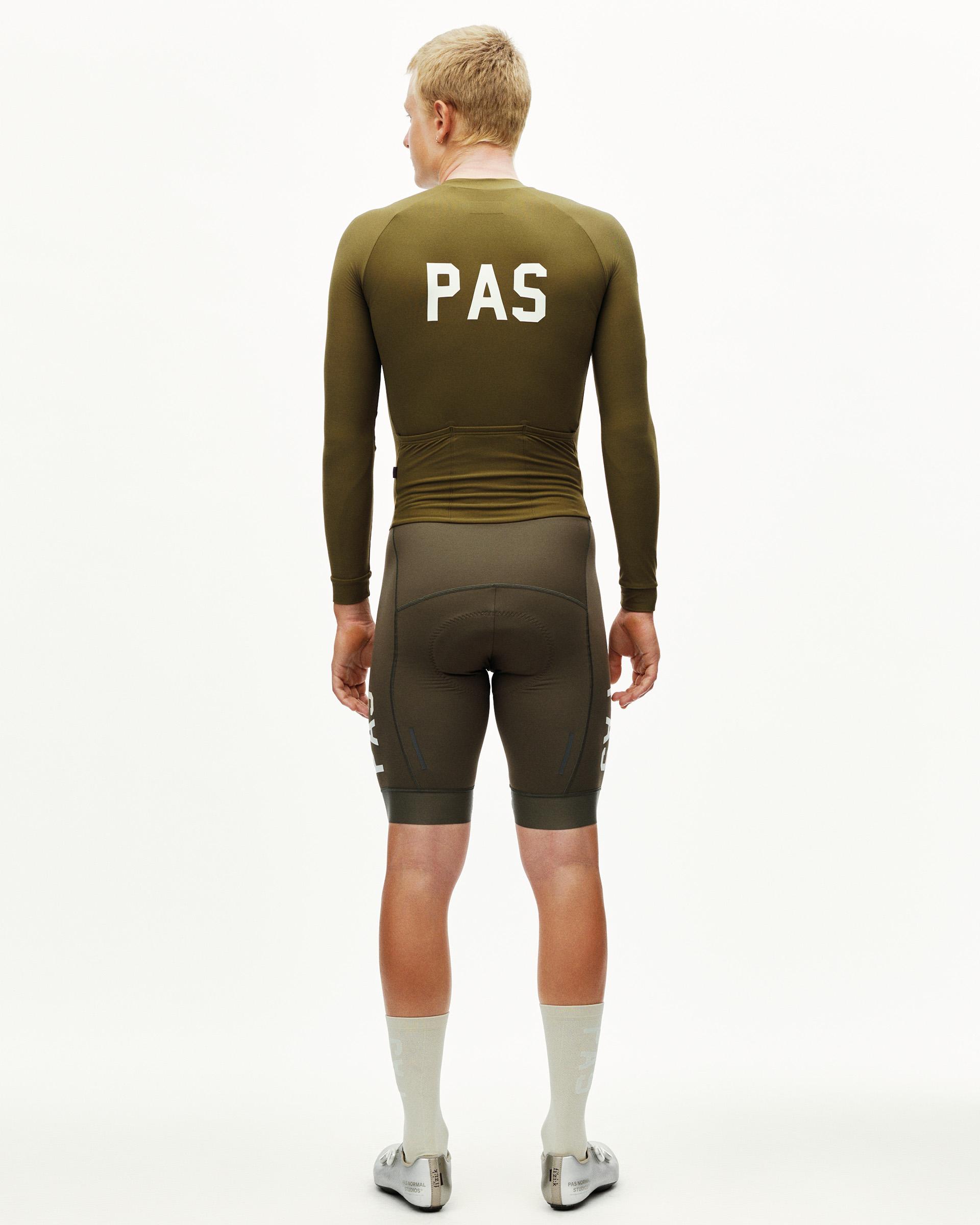 Moss Brown PAS Thermal cycling speedsuit on model, rear view with white PAS back print