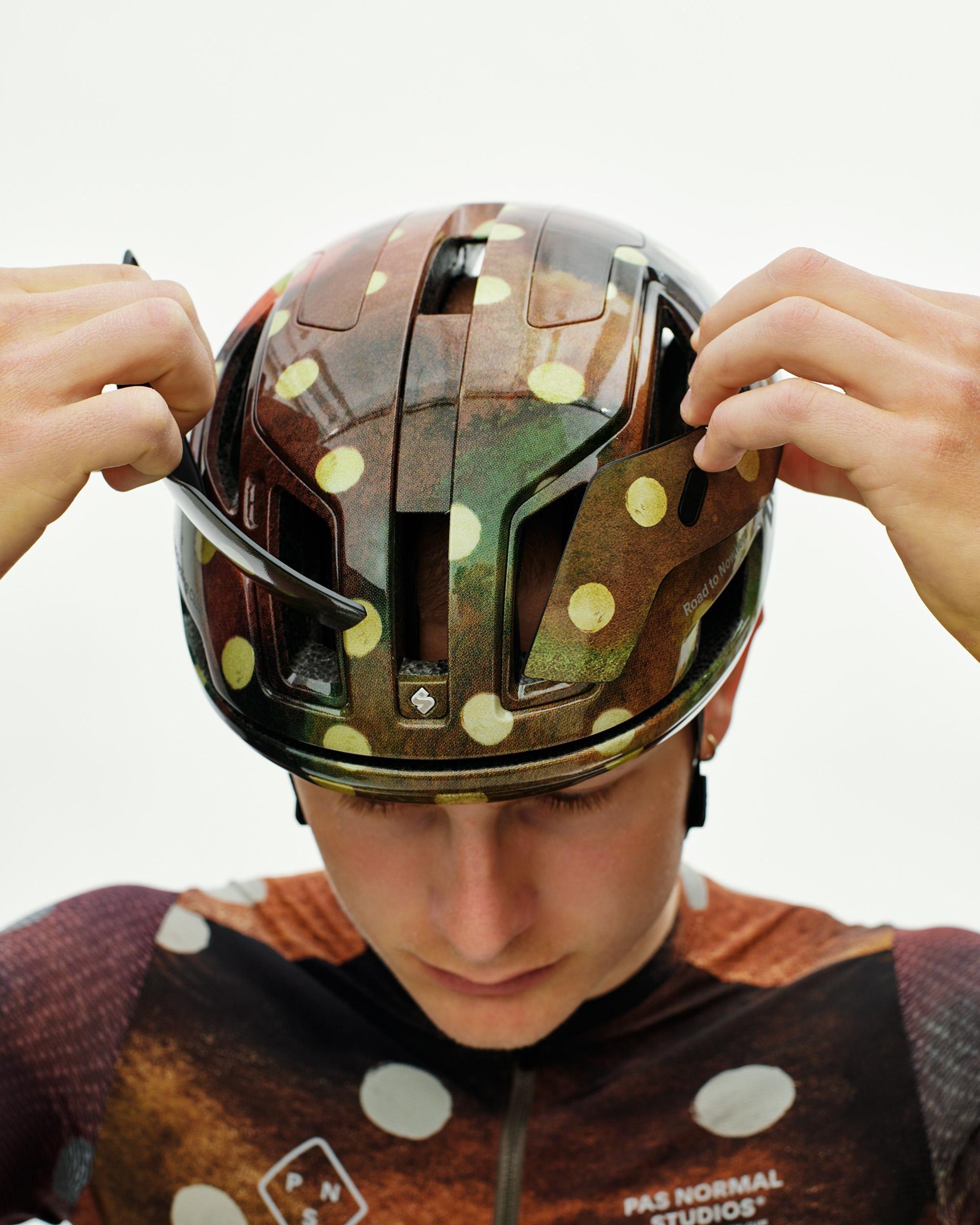 Brown T.K.O. Falconer Aero 2Vi cycling helmet on model with yellow polka dot pattern