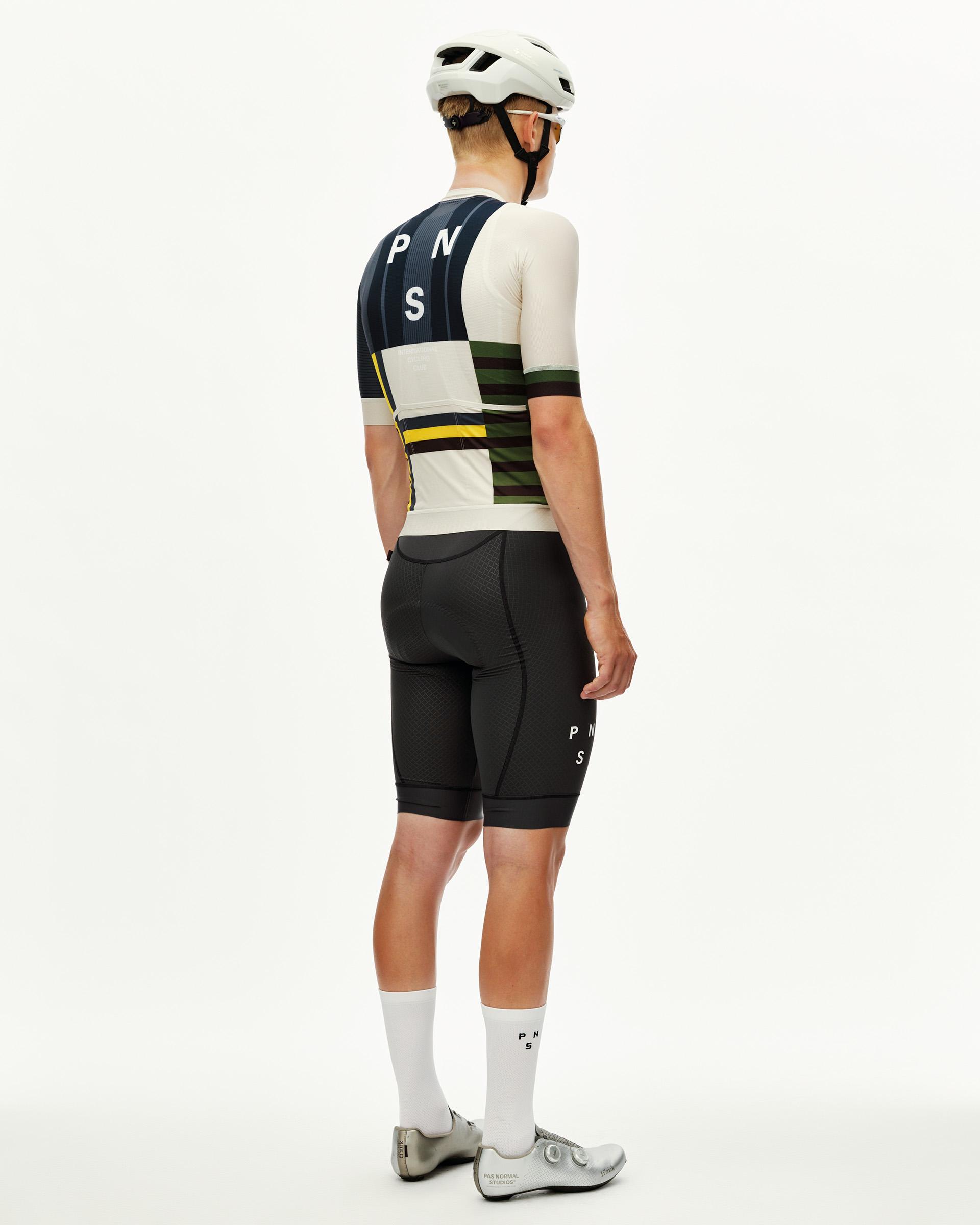 International Sand Mechanism cycling jersey on model, rear view with navy and olive block stripe print