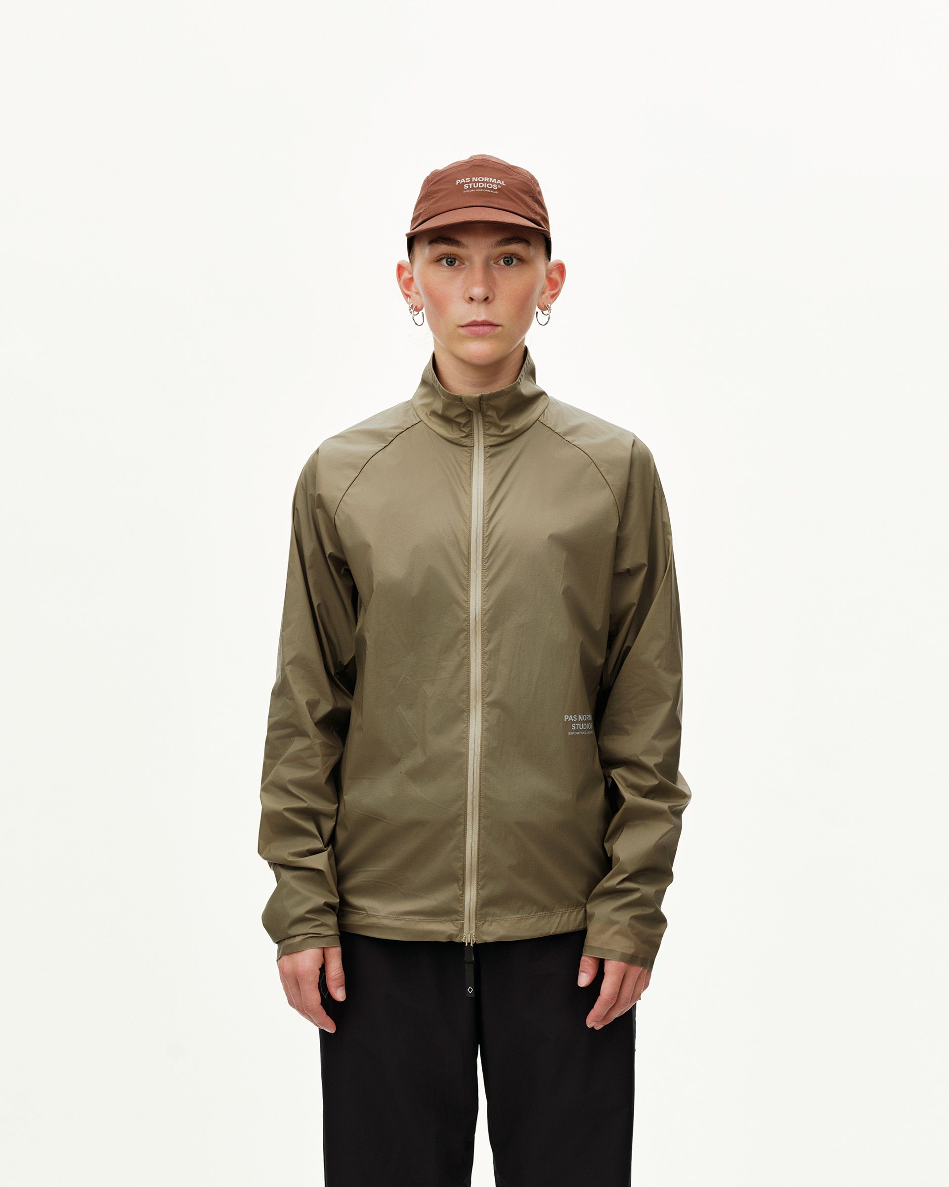 Dusty Earth khaki Balance Windproof jacket on model, front view with full zip and high collar