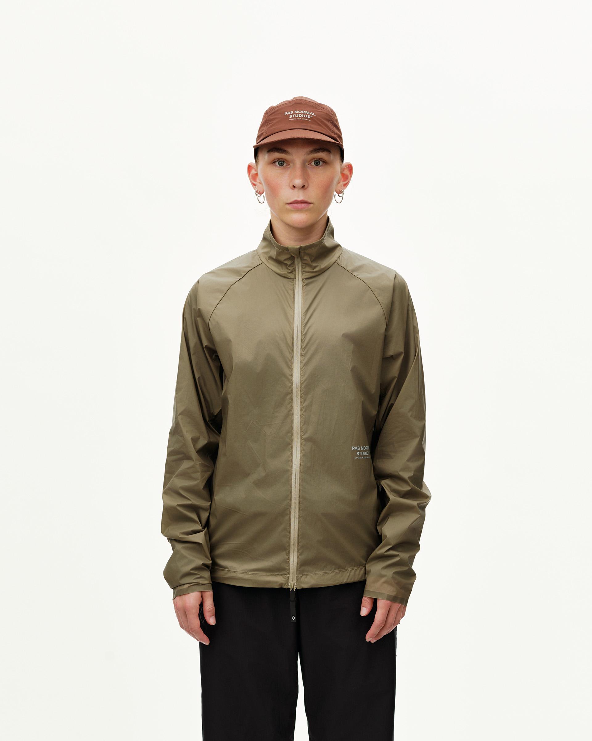 Dusty Earth khaki Balance Windproof jacket on model, front view with full zip and high collar