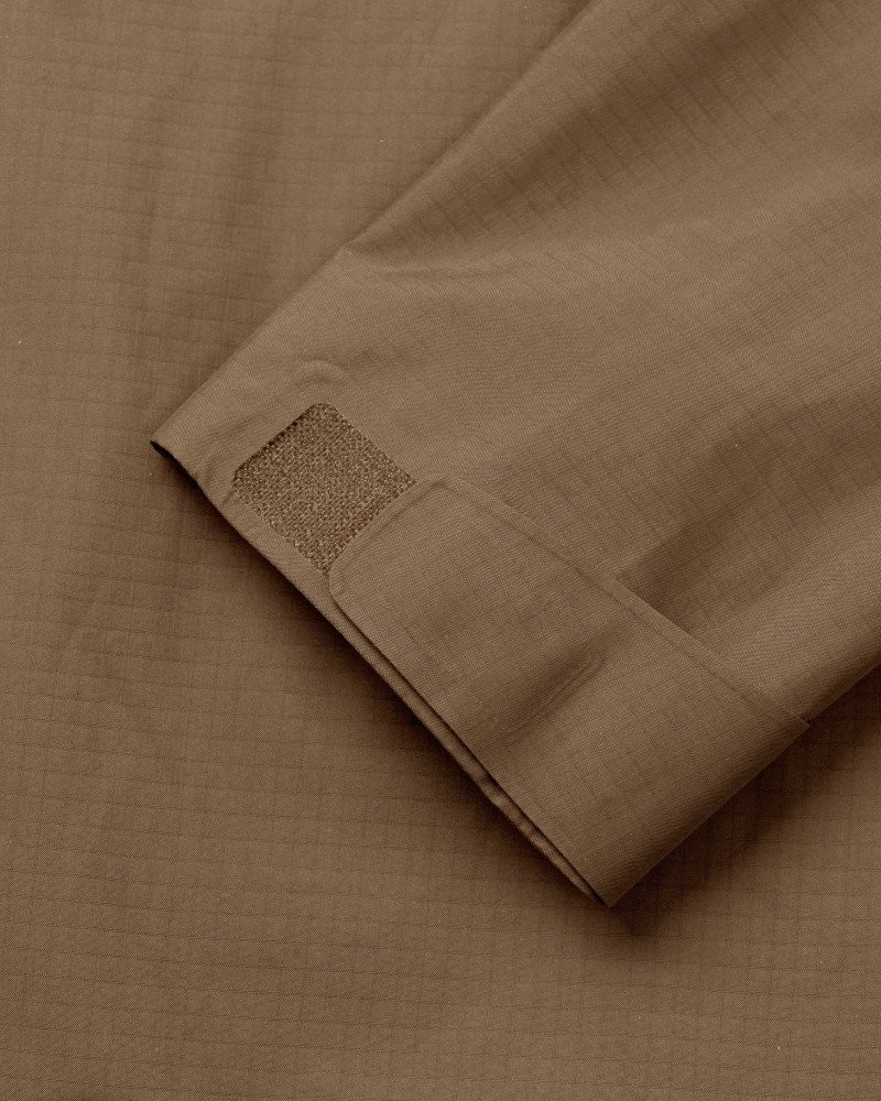 Army Brown Off-Race Shell jacket detail view showing textured square patch on sleeve cuff