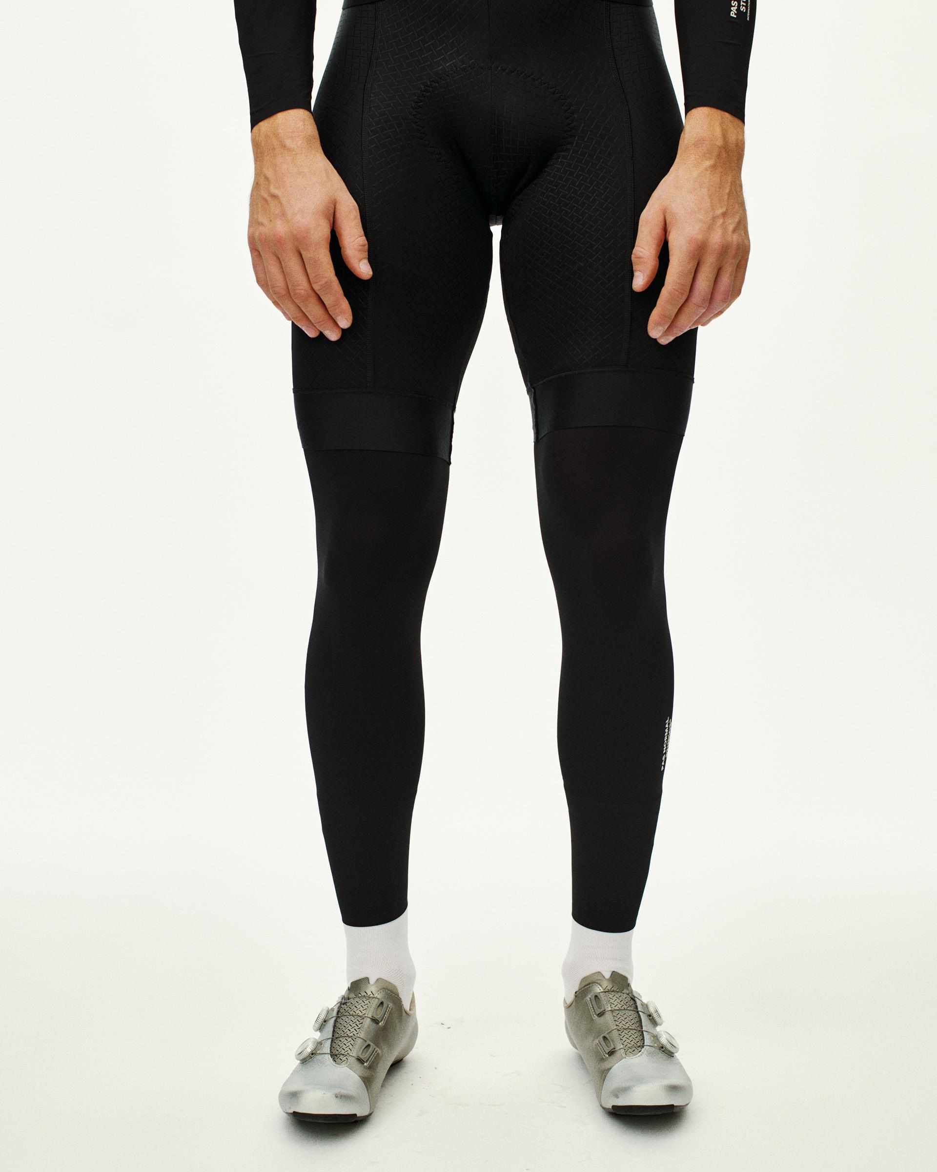 Black Logo Leg UV Protector leg warmers on model front view with textured knee panels