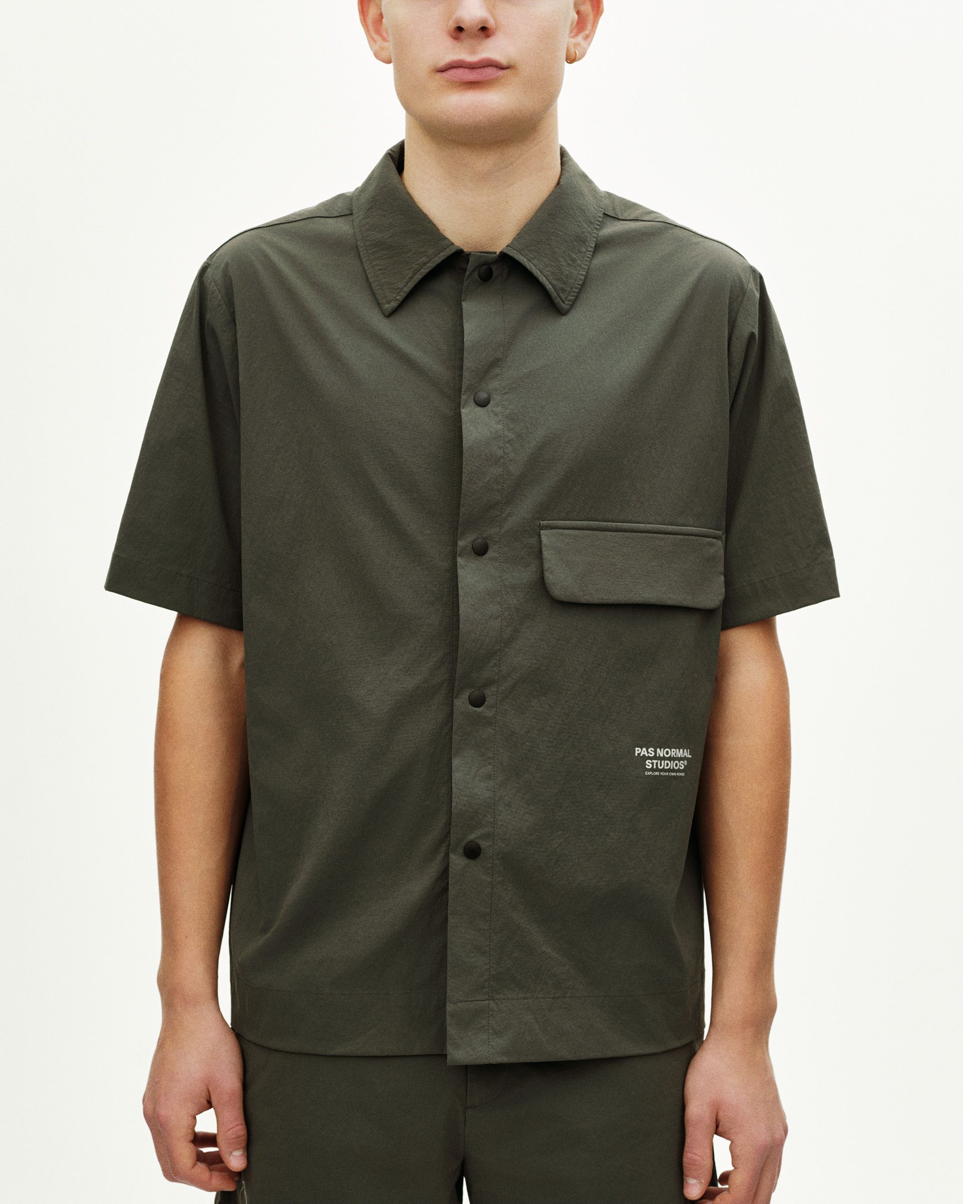 Dark Grey Off-Race Light Tech shirt on model, front view with chest pocket and button closure