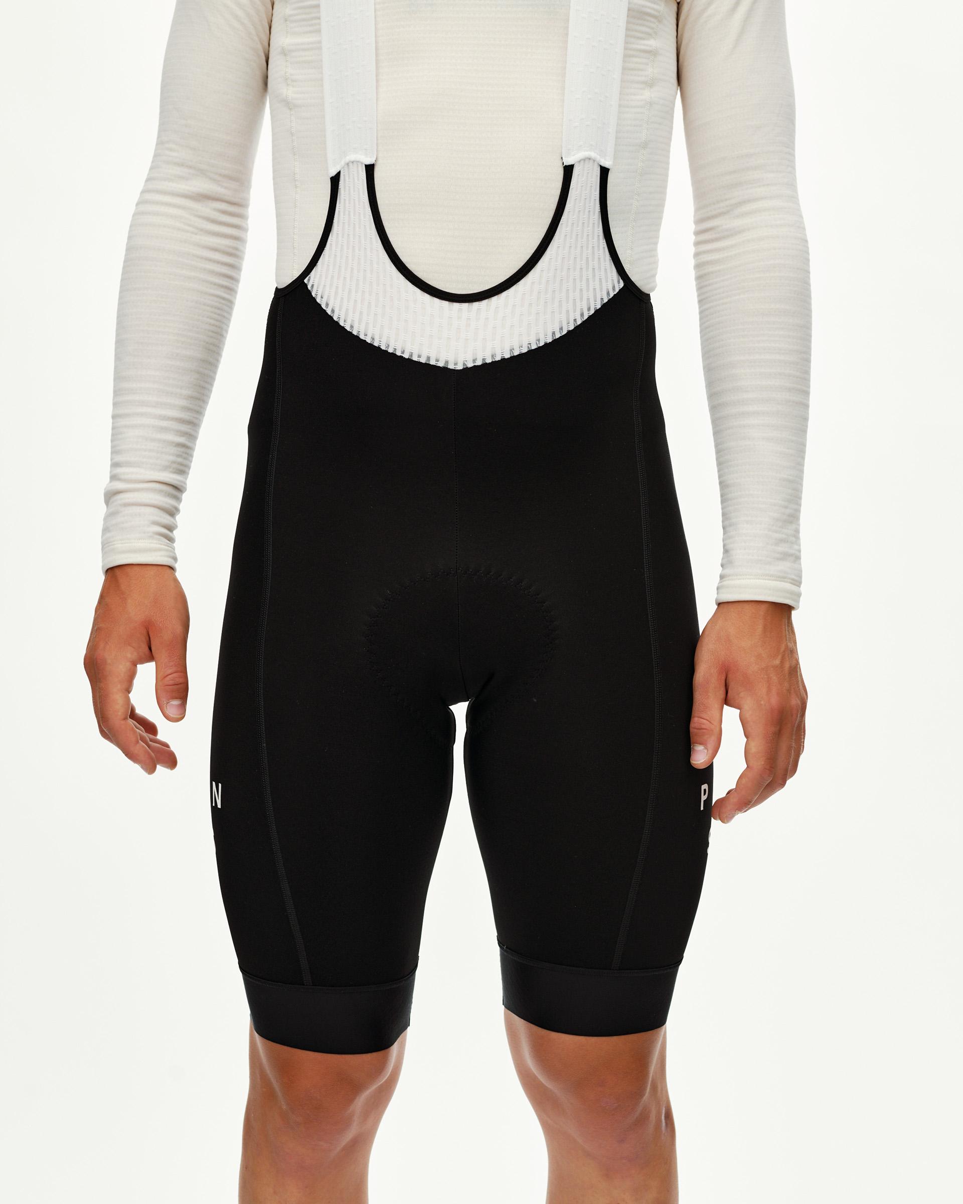 Black Mechanism Thermal cycling bibs on model, front view with mesh bib panel