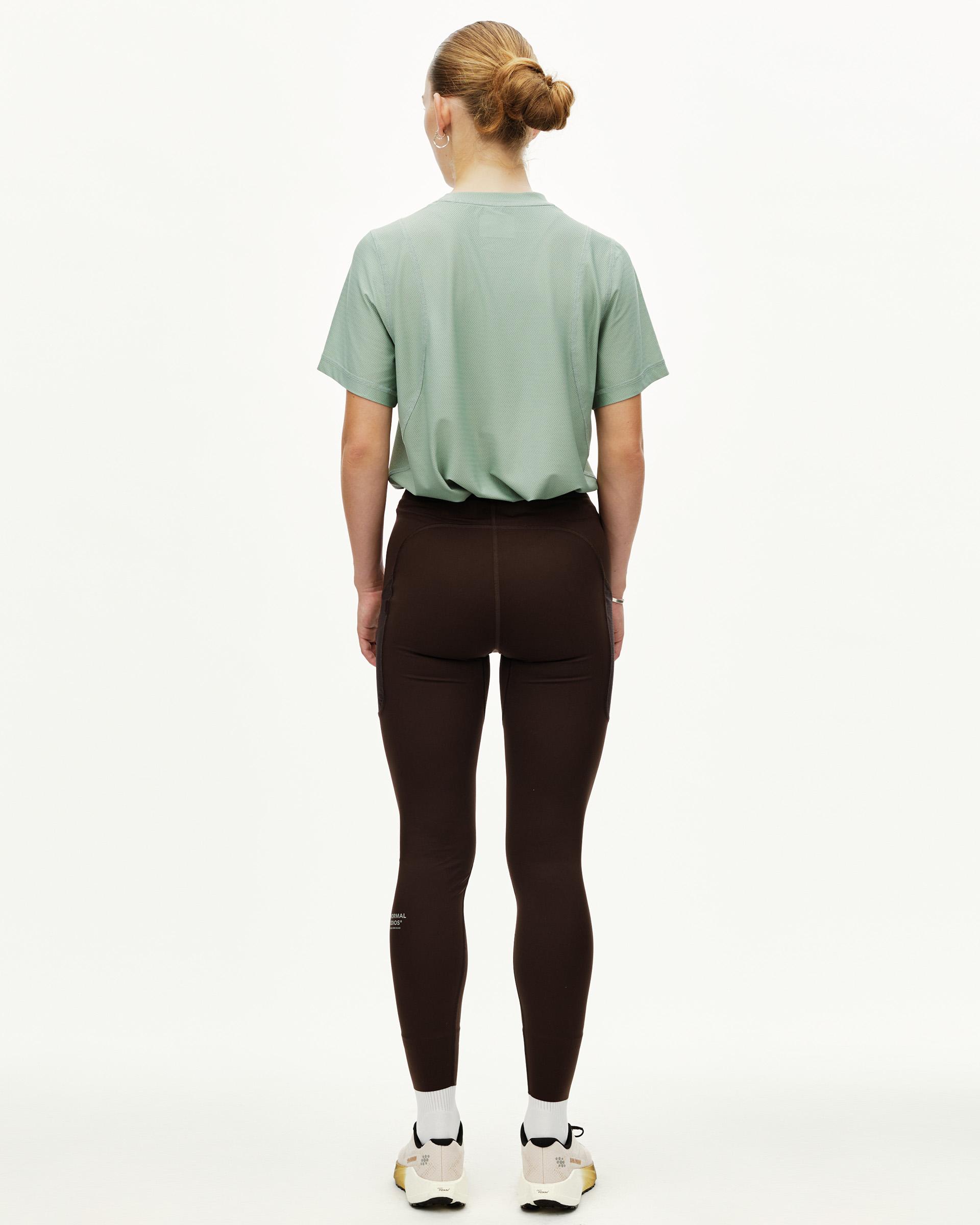 Dark Coffee brown Balance women's long tights on model, rear view with side panel detail