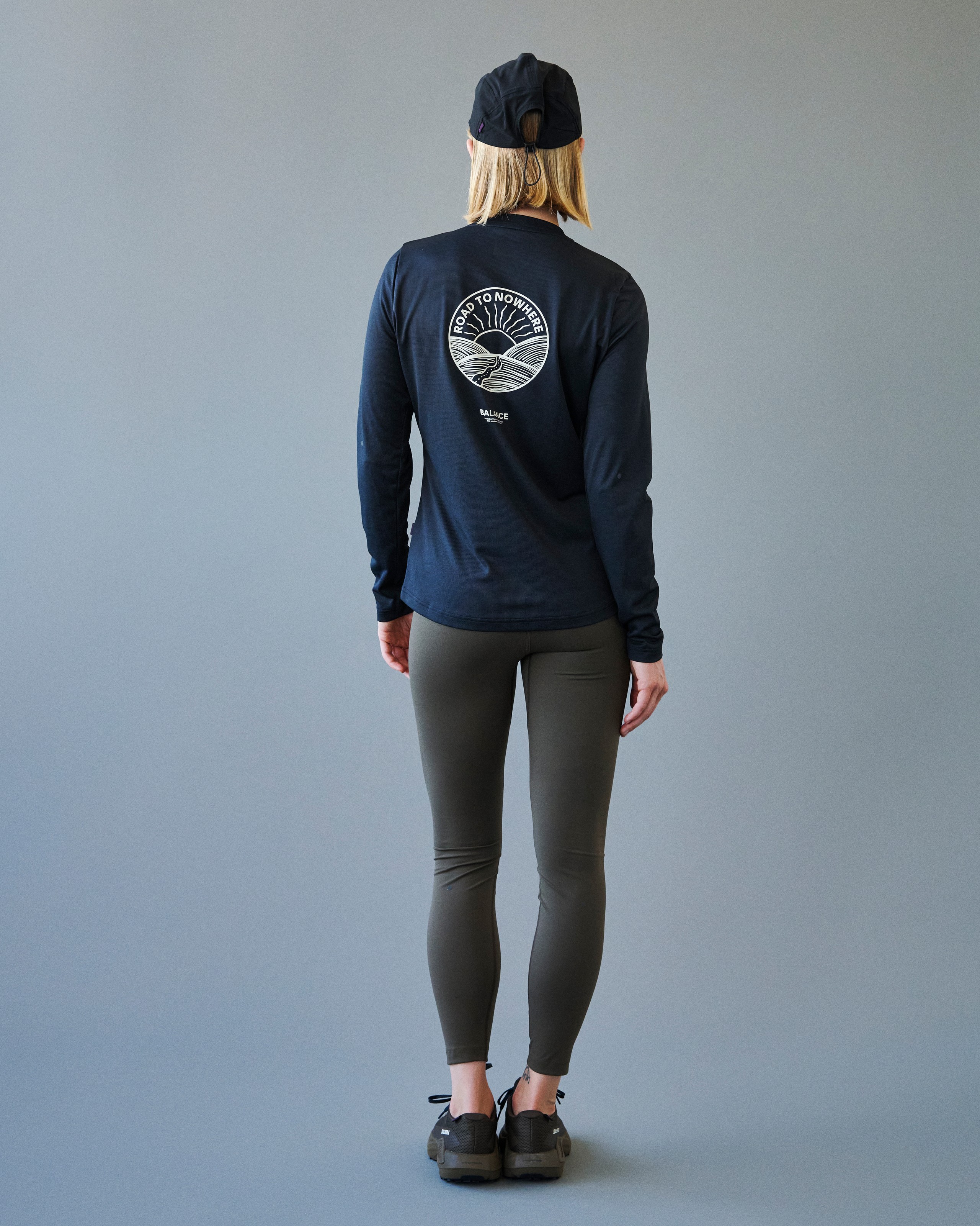 Navy Balance long sleeve t-shirt on model, rear view with white circular graphic print