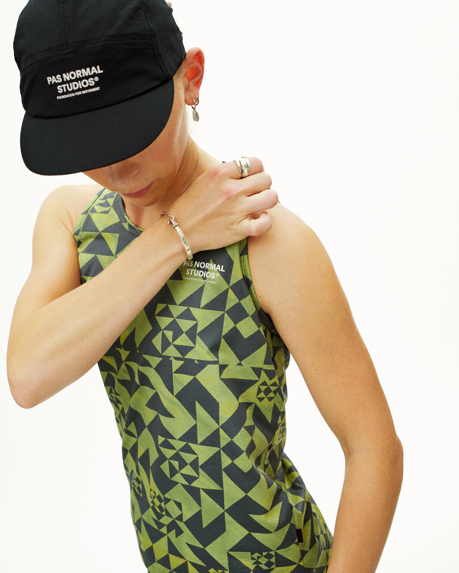 Green Balance singlet on model with geometric origami print
