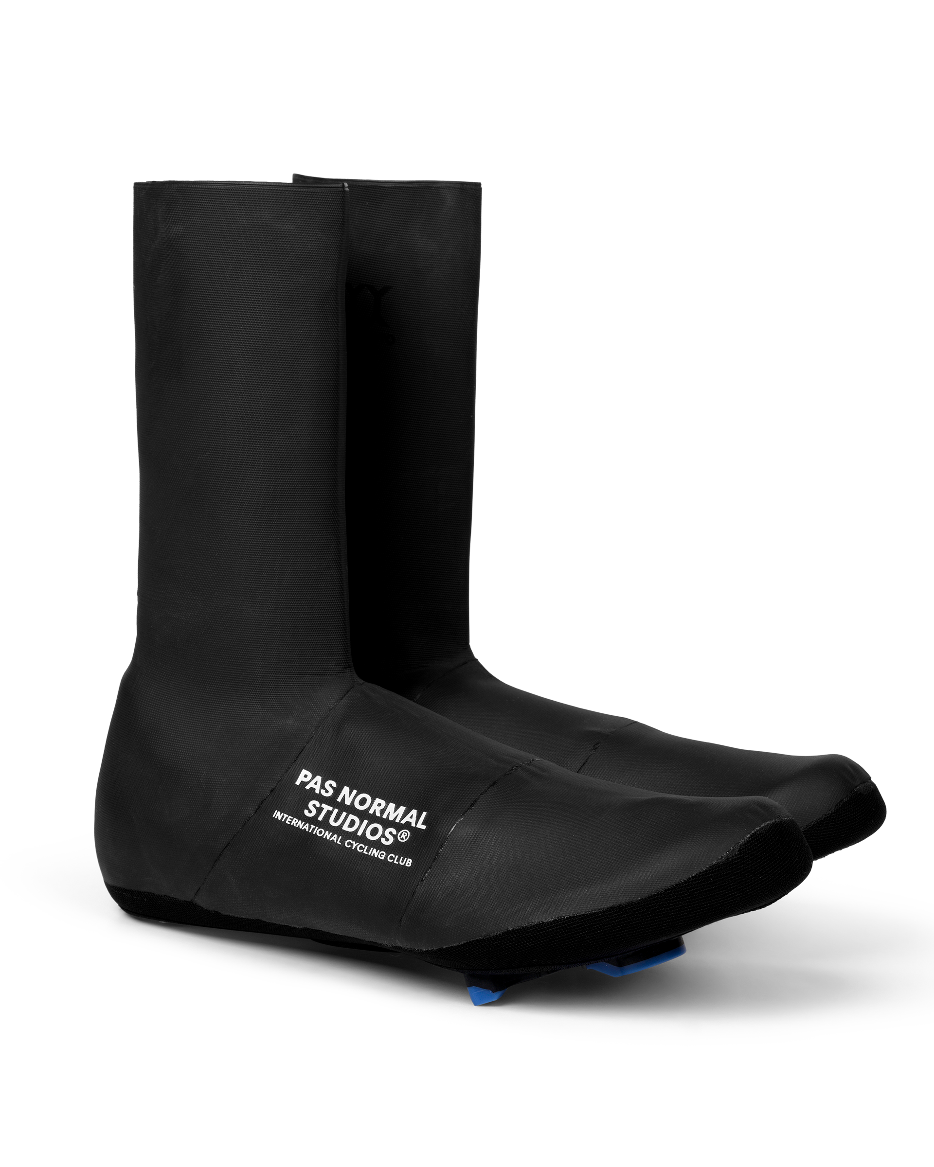 Black Logo Heavy cycling overshoes, three-quarter view with white chest logo and blue cleat cutout