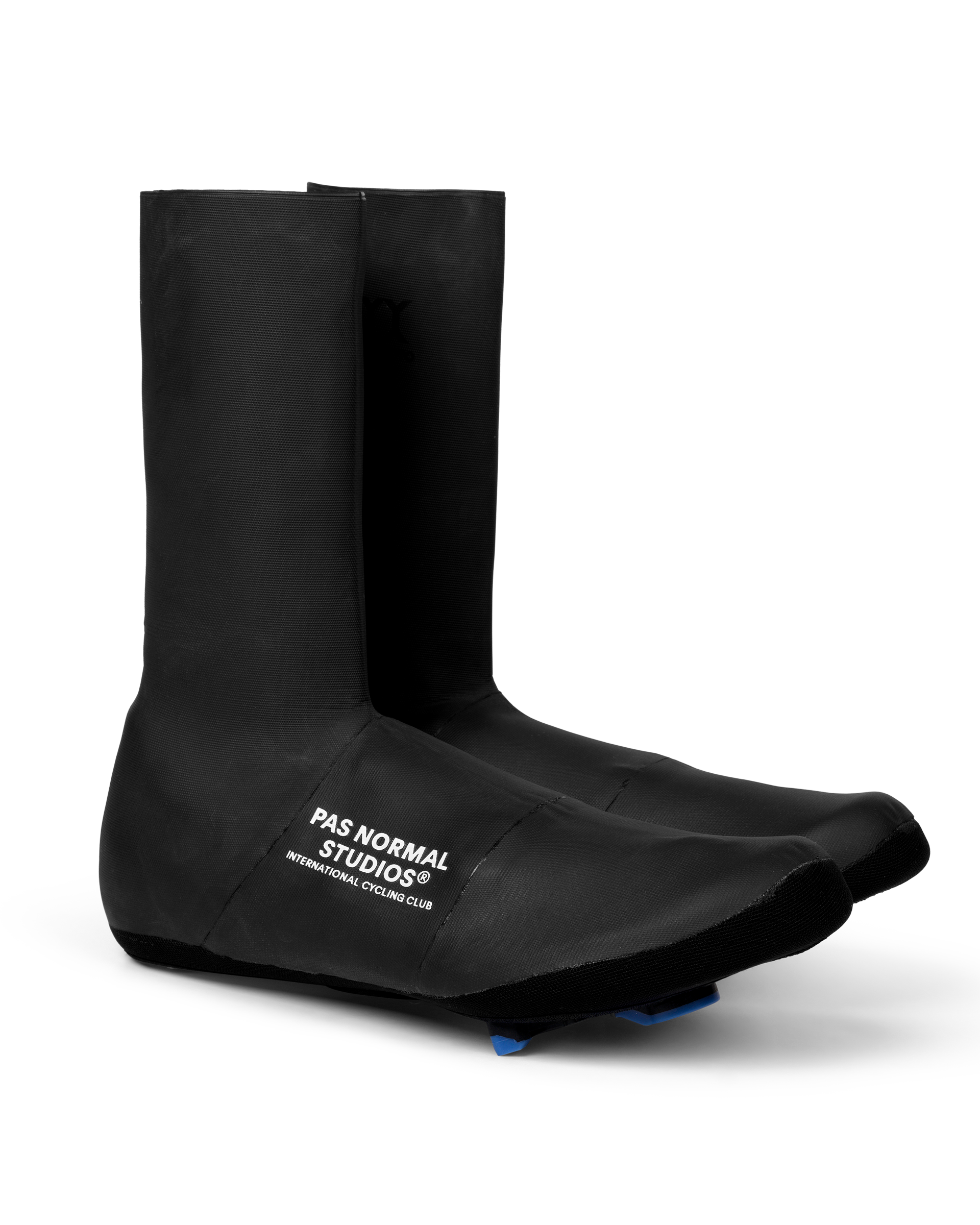 Black Logo Heavy cycling overshoes, three-quarter view with white chest logo and blue cleat cutout