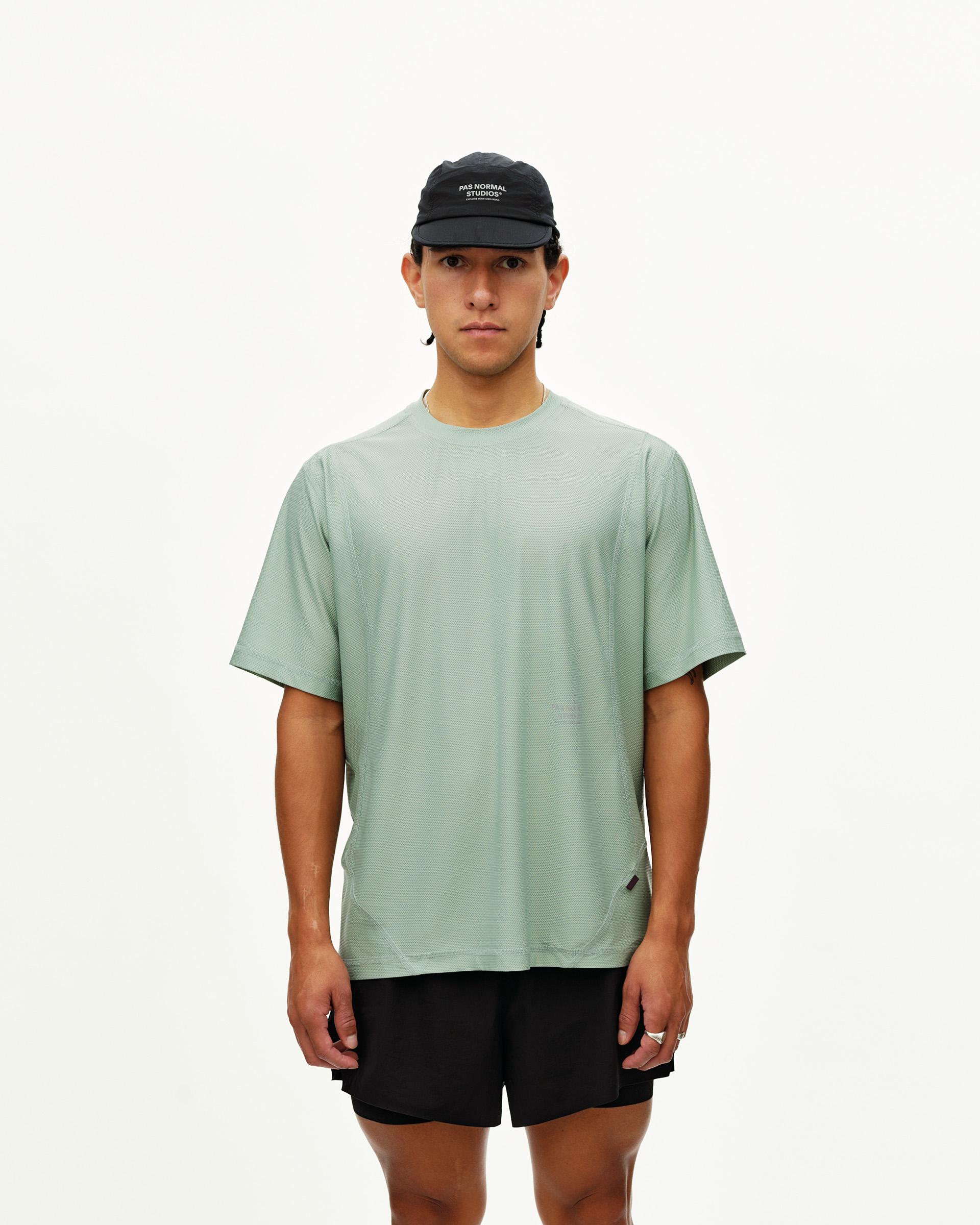 Green Sage Balance T-shirt on model, front view with textured fabric and curved hem seams