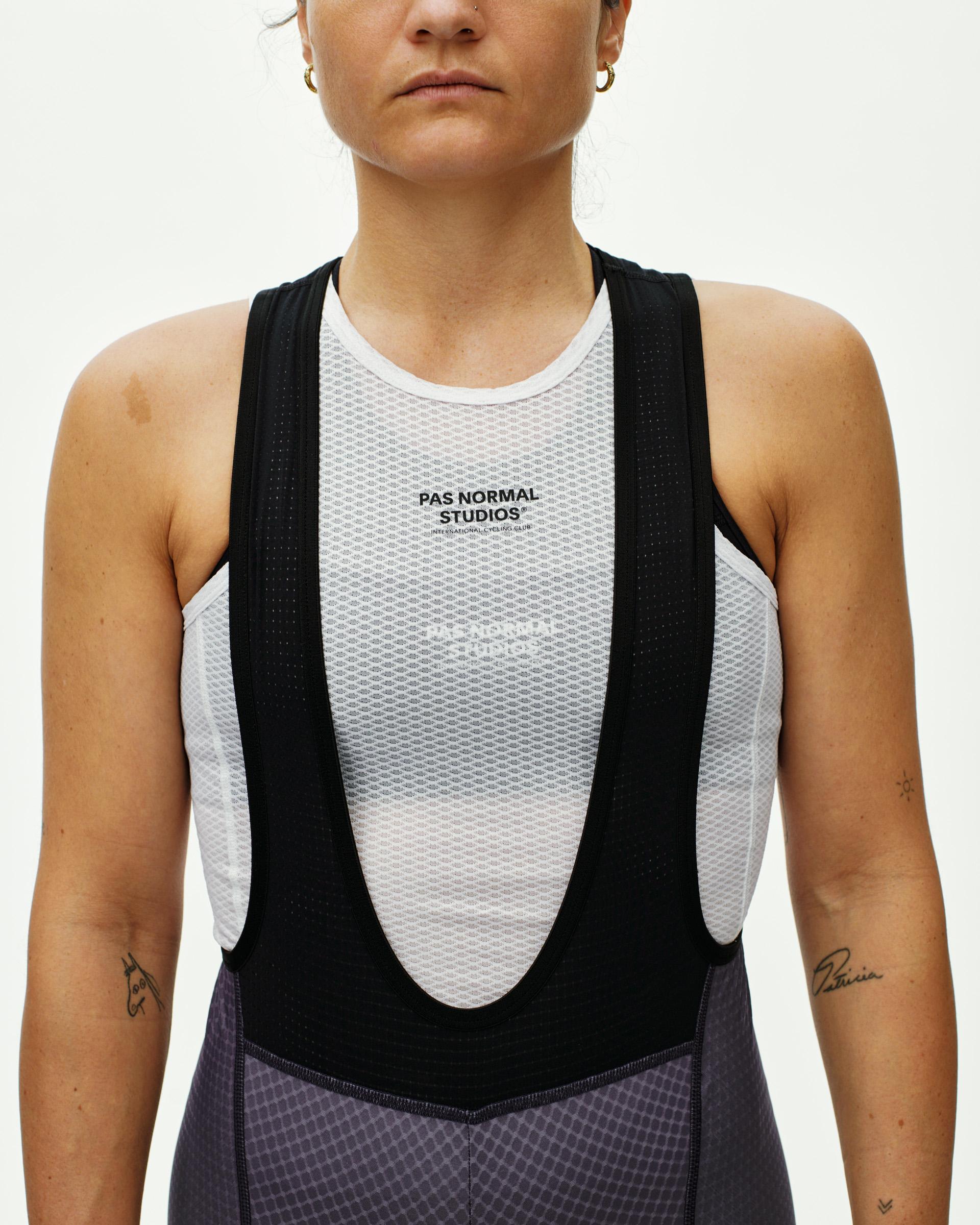 Iron Grey Essential cycling bibs on model, front view with black bib straps and mesh base layer