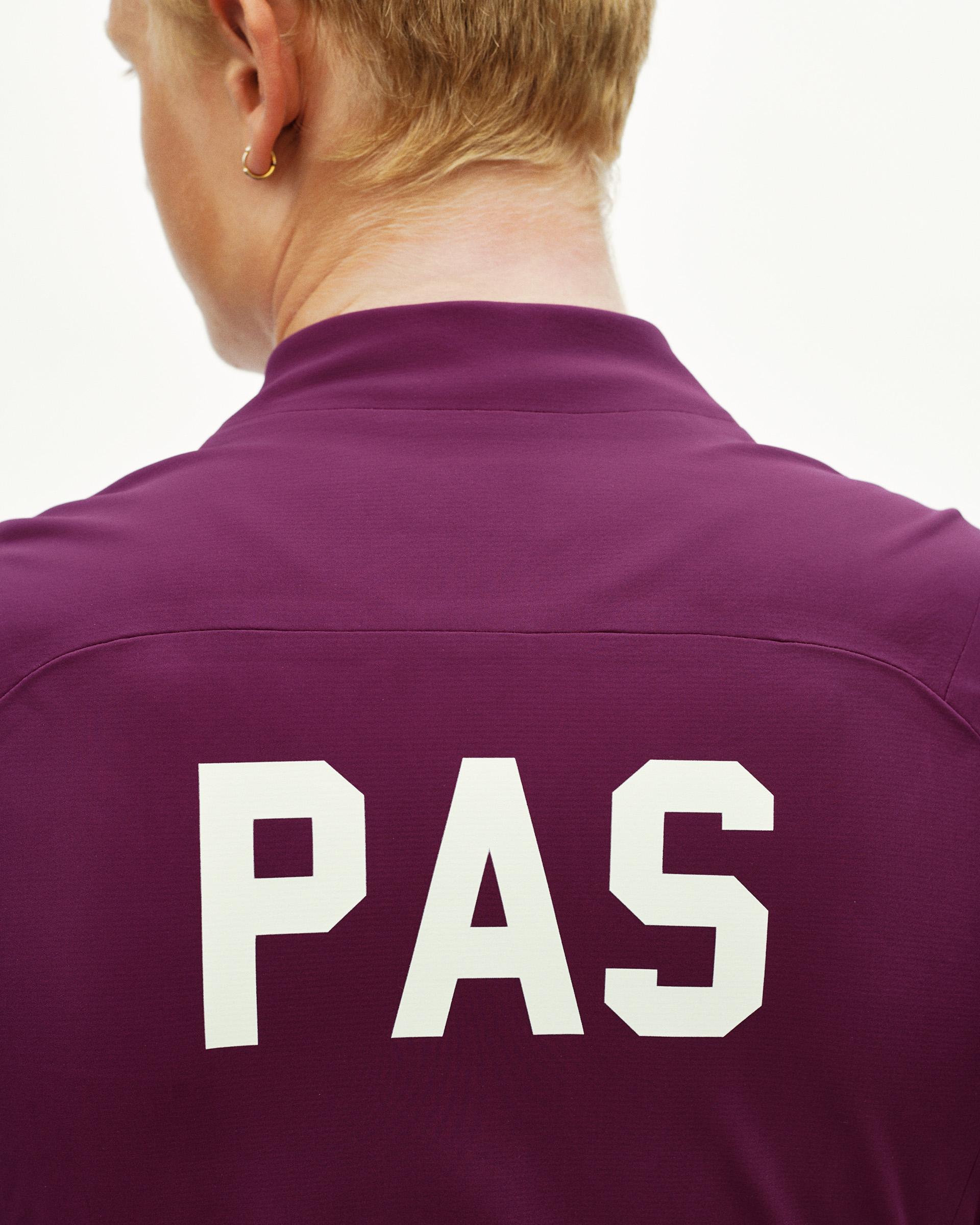 Dark Purple PAS Mechanism Thermal cycling jacket, rear detail on model with large white PAS back print