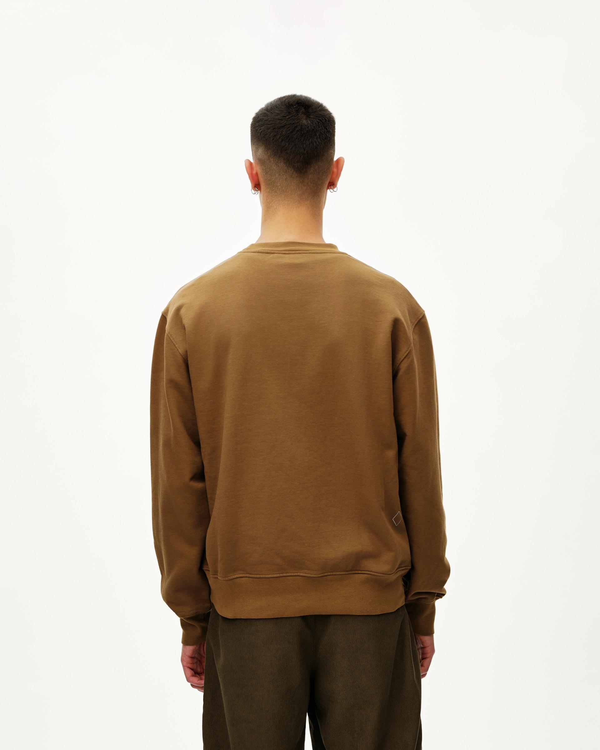 Wood brown Off-Race sweatshirt on model, rear view with ribbed hem and cuffs