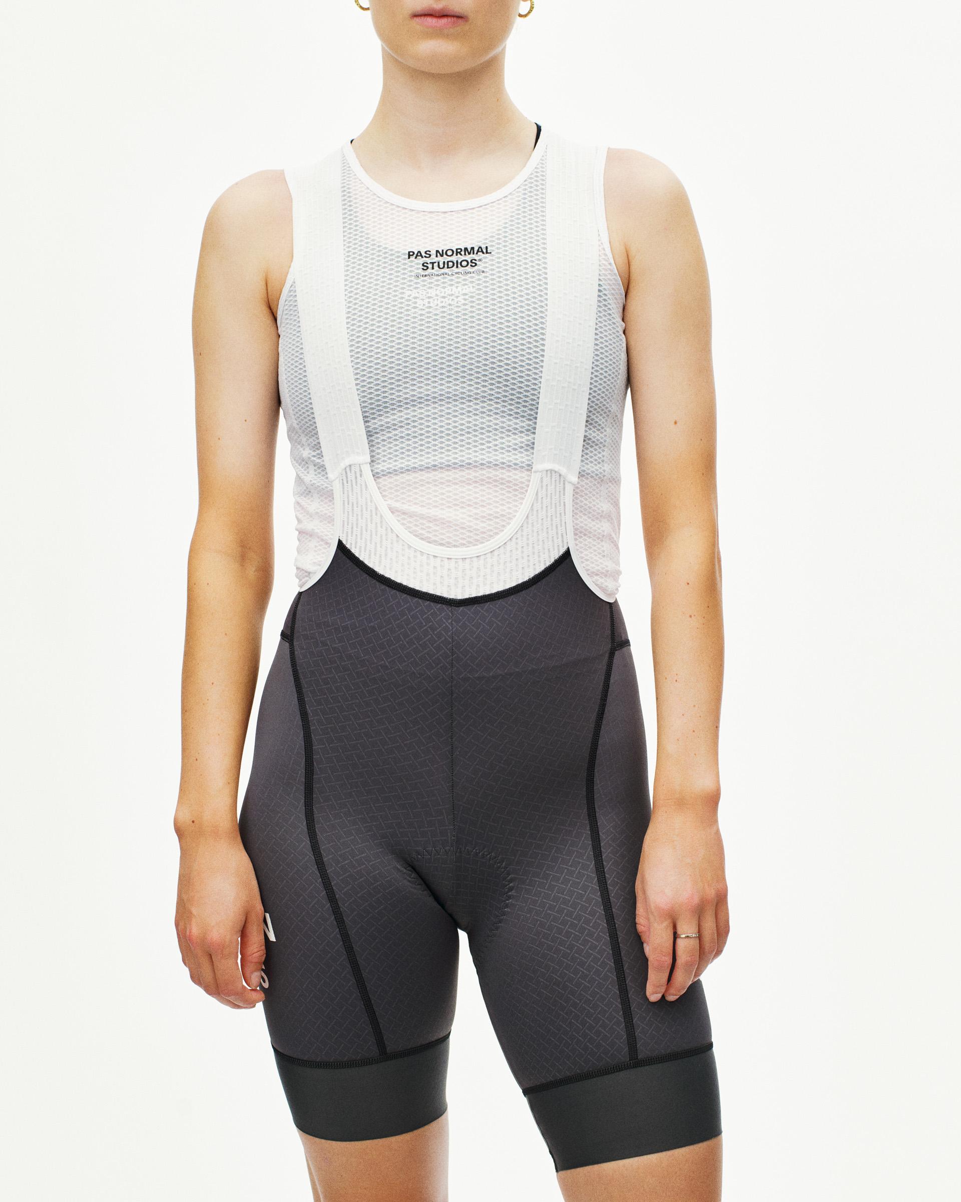 Grey Mechanism cycling bibs on model, front view with white mesh bib panel