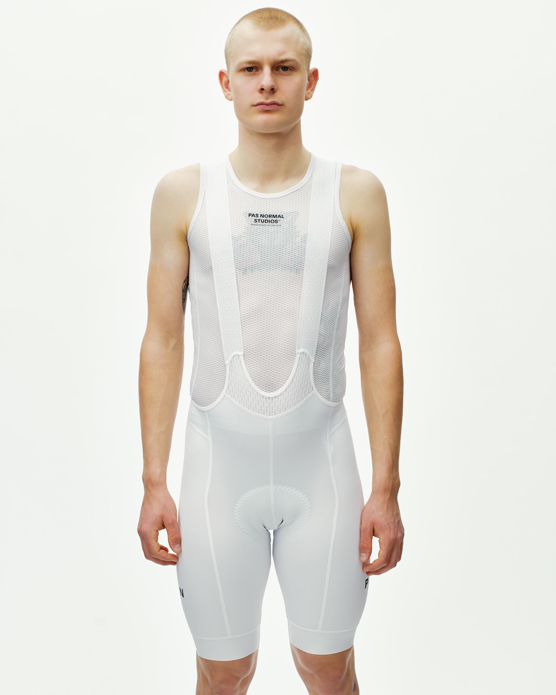 White Mechanism cycling bibs on model, front view with mesh upper panel