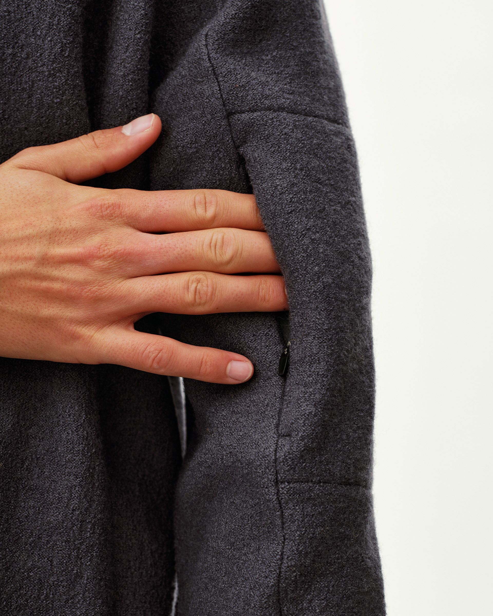 Steel grey Off-Race Boiled Wool Half-Zip outerwear, detail view on model showing side zip pocket