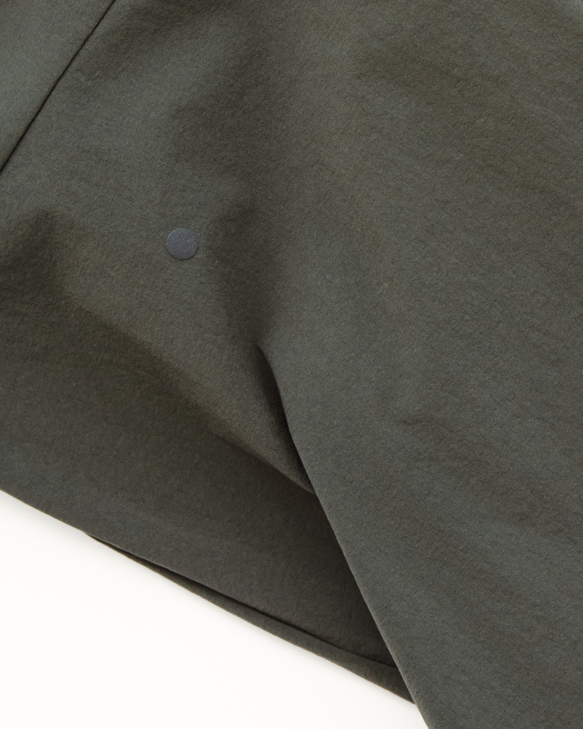 Reflective dot on dark cycling fabric for enhanced visibility in low light conditions