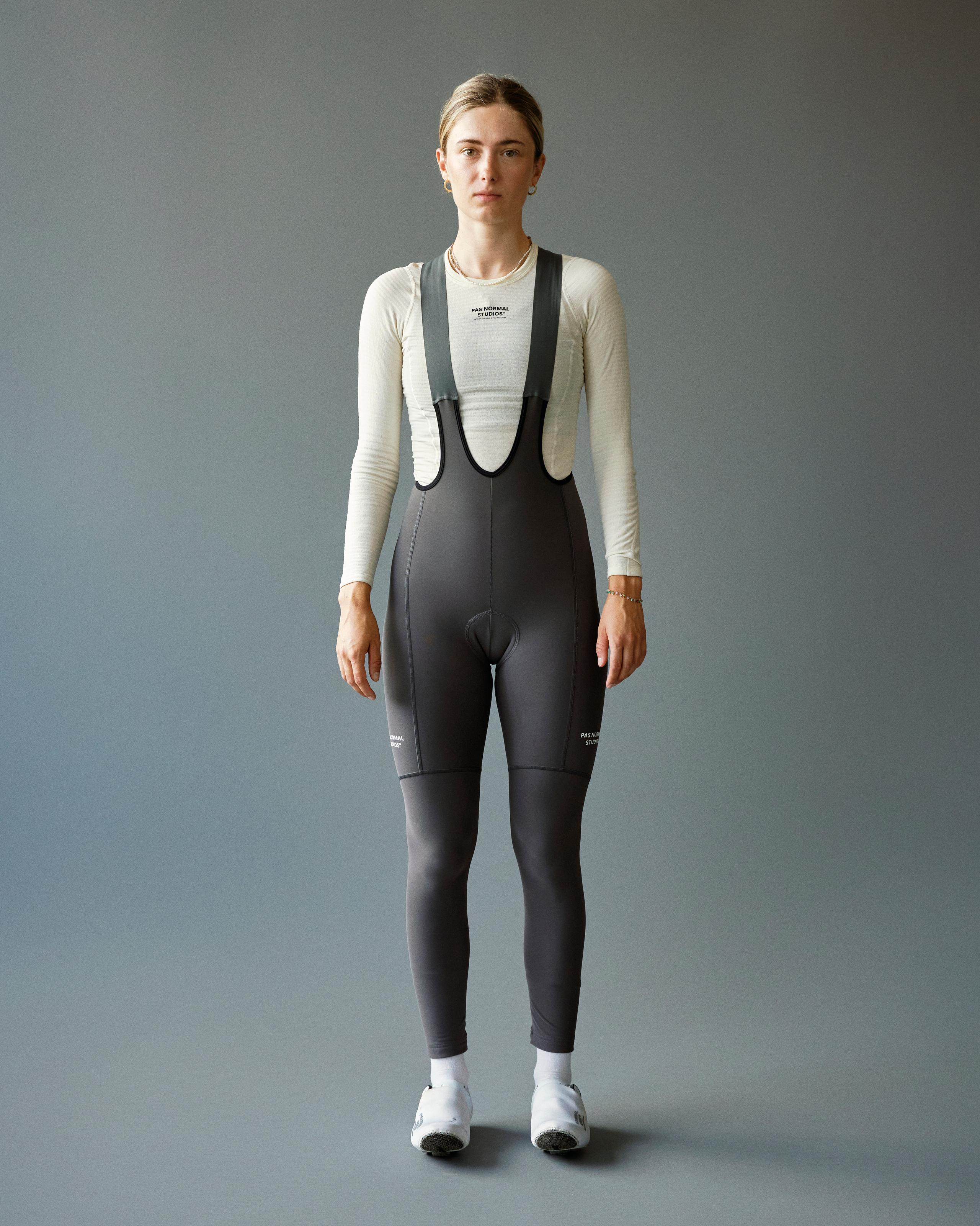 Stone Grey Essential Thermal Long cycling bibs on model, front view with high bib panel
