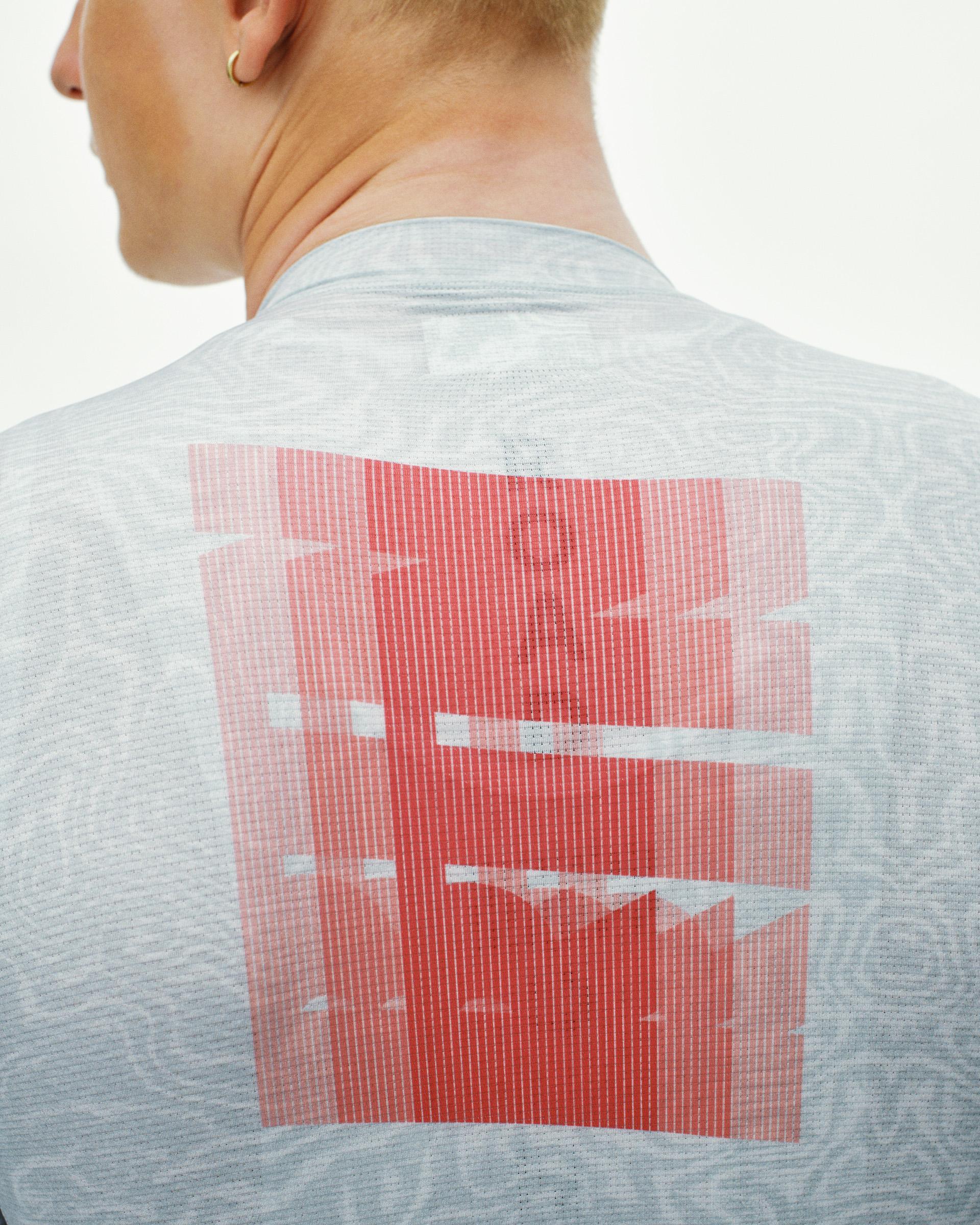Light Blue Mechanism cycling jersey, rear detail on model with red graphic back print