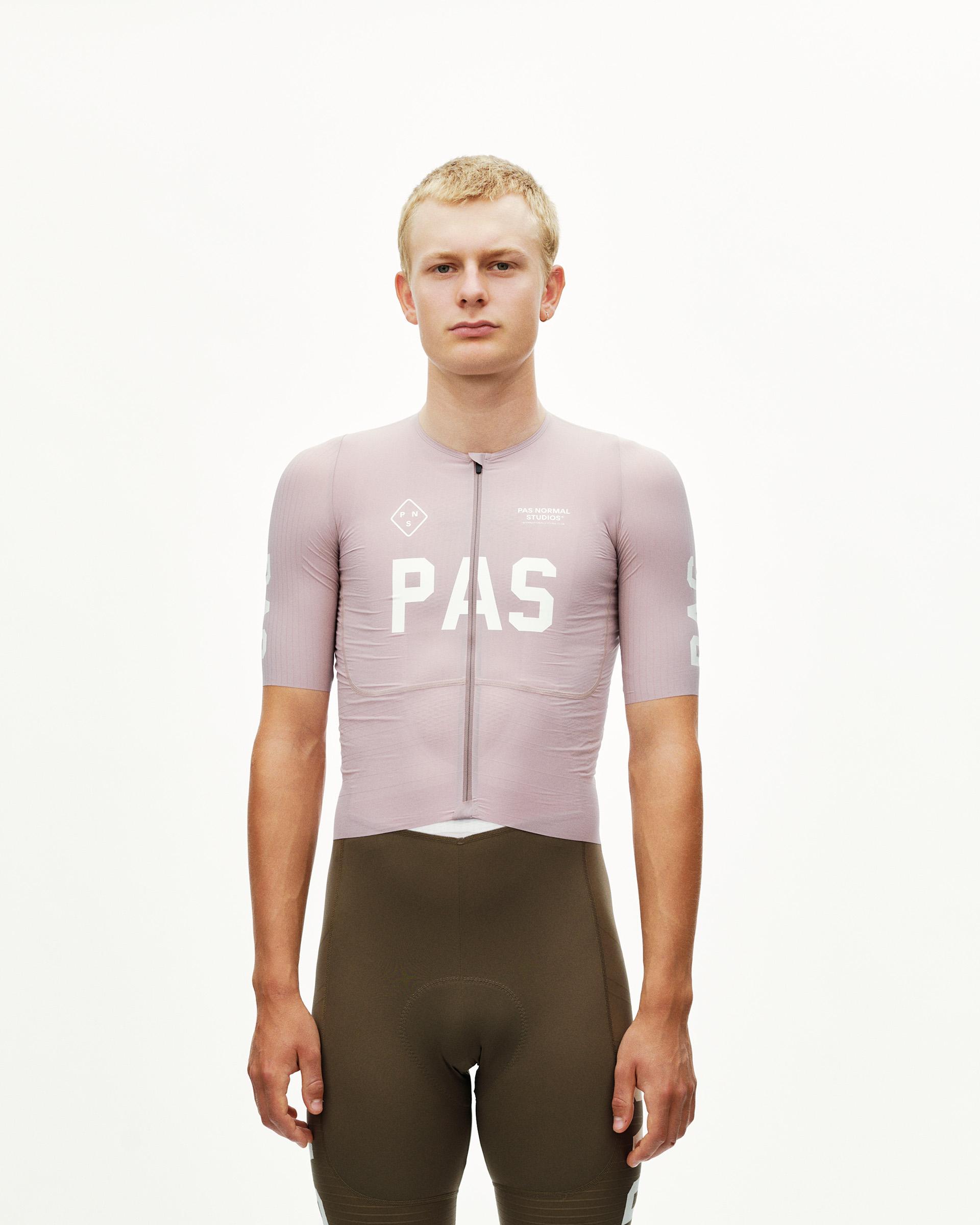 Taupe Rose PAS Mechanism Pro men's cycling jersey on model, front view with white chest logo print