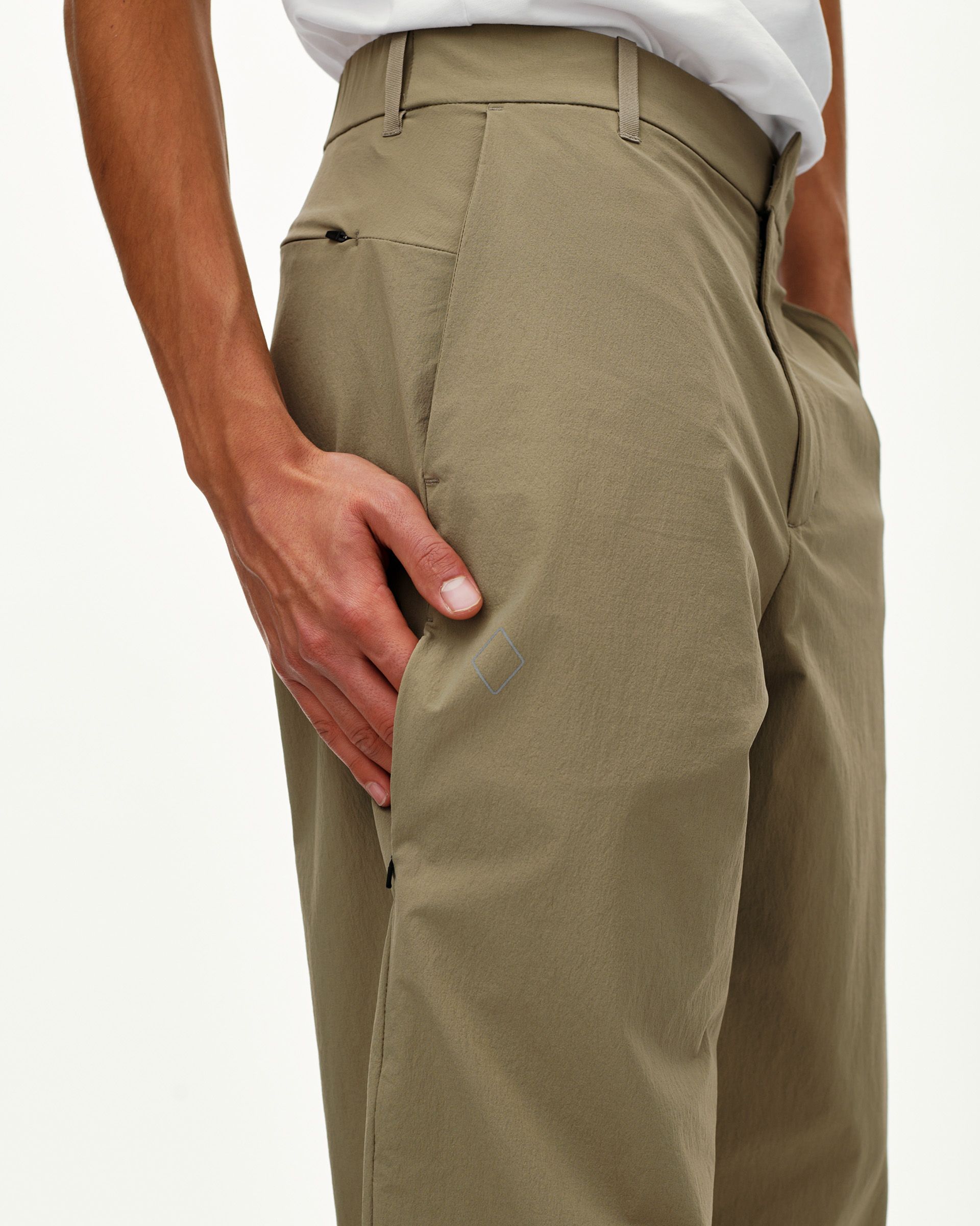 Dusty Earth khaki Off-Race Tech pants on model, rear detail view with side pocket