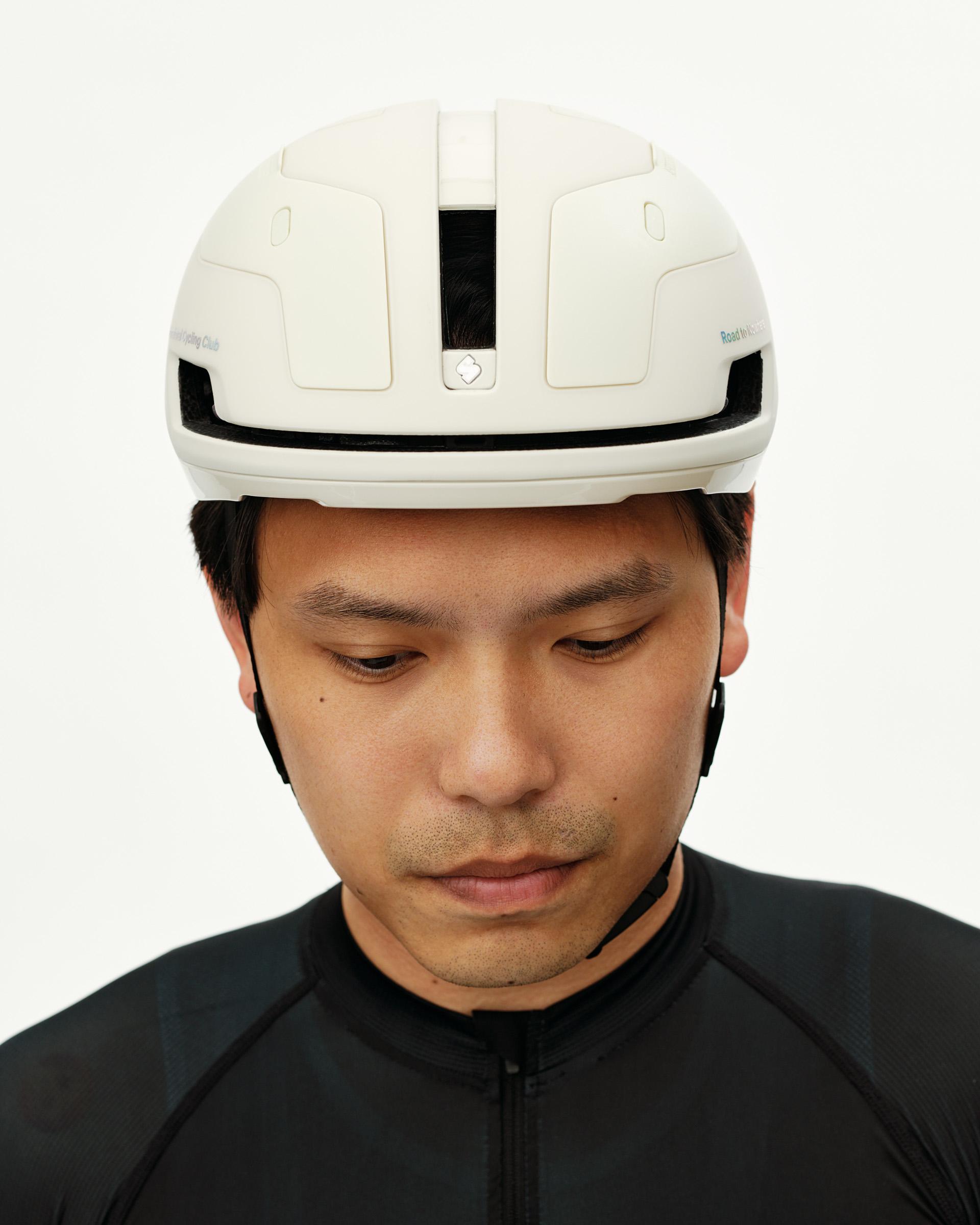 Off White Sweet Protection Falconer Aero 2Vi Round Fit cycling helmet on model, front view with minimal venting