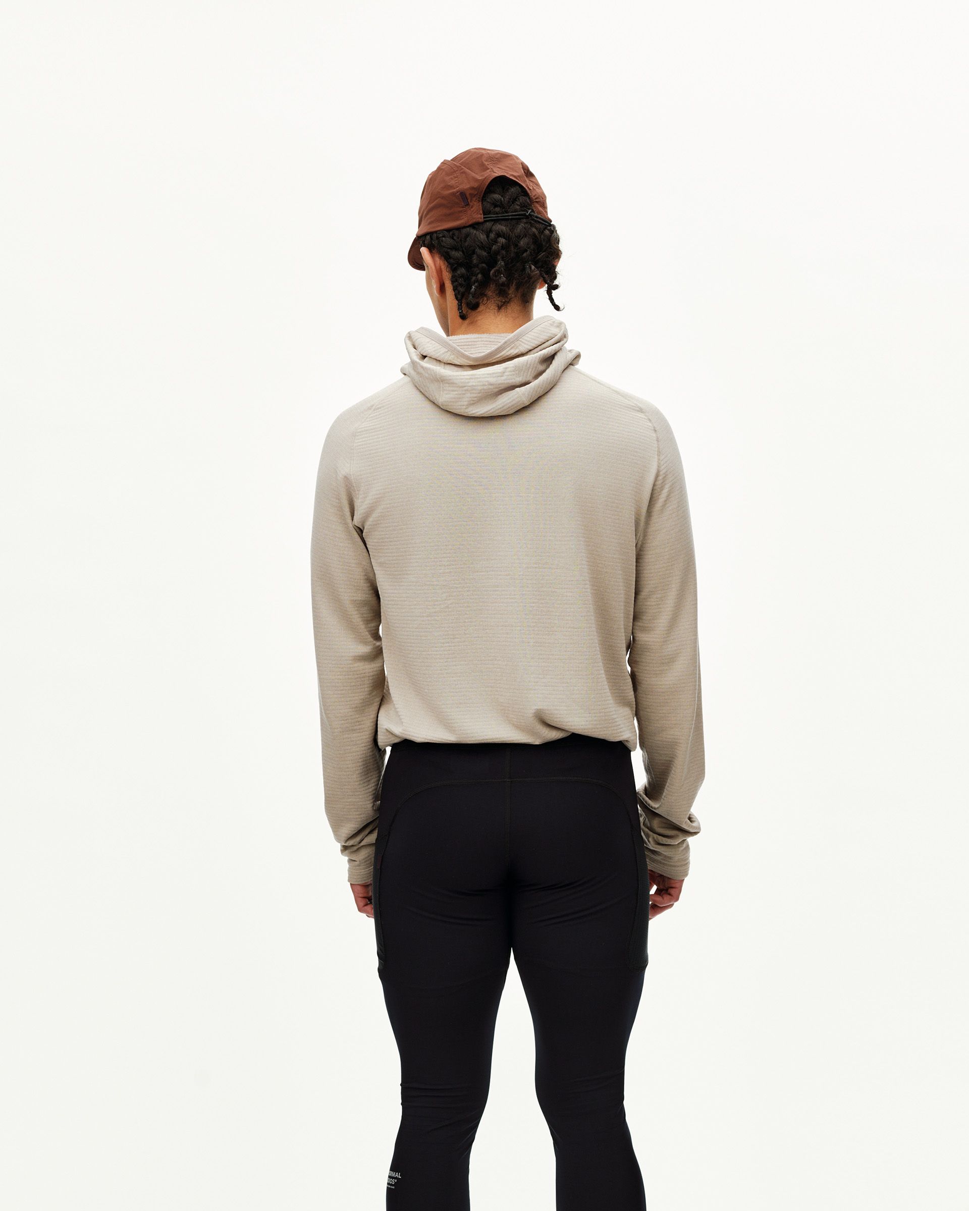 Black Balance long tights on model, rear view with fitted leg and side pocket