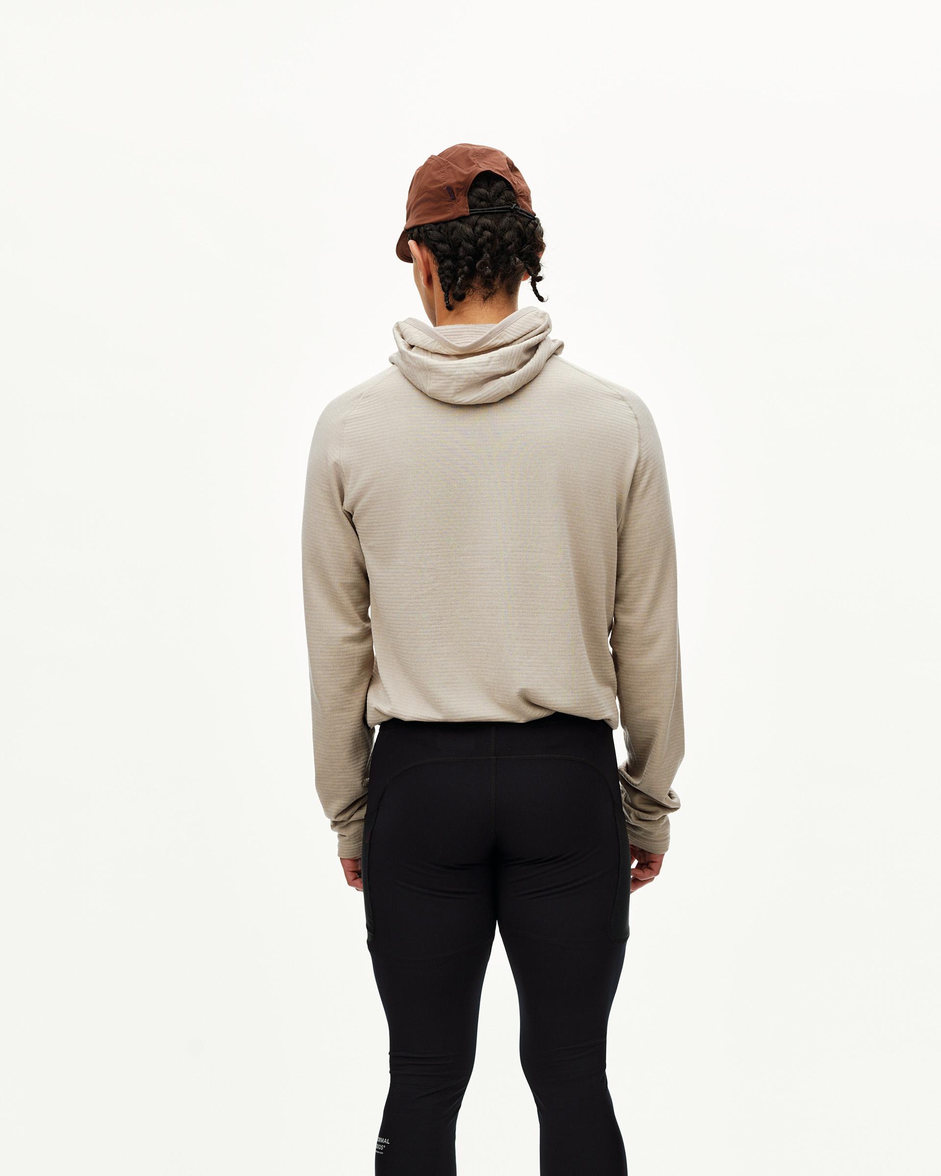 Black Balance long tights on model, rear view with fitted leg and side pocket